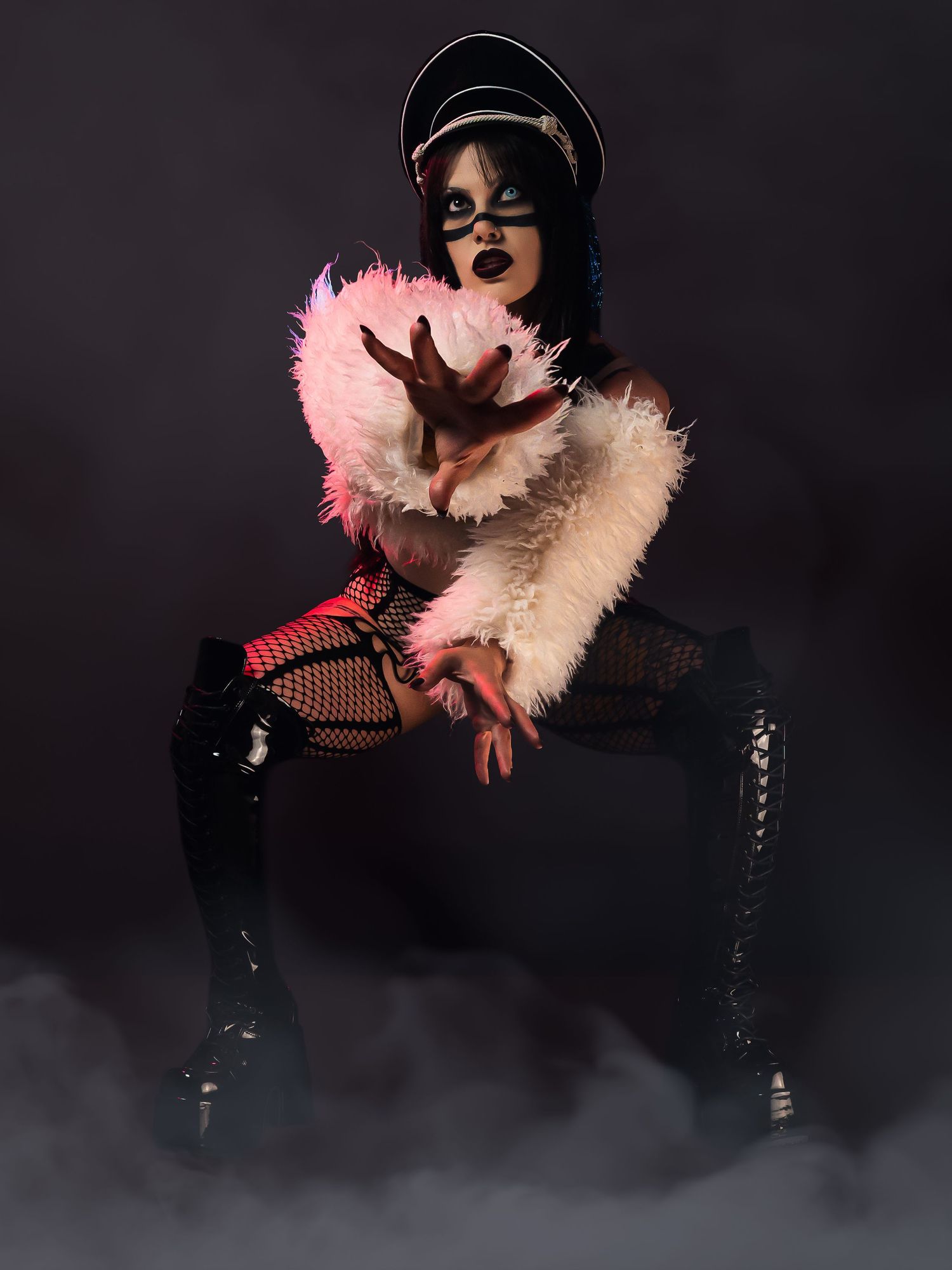 High-fashion portrait with bold magenta and electric blue creative lighting, 1990s industrial metal aesthetic, by JRange Photography.
