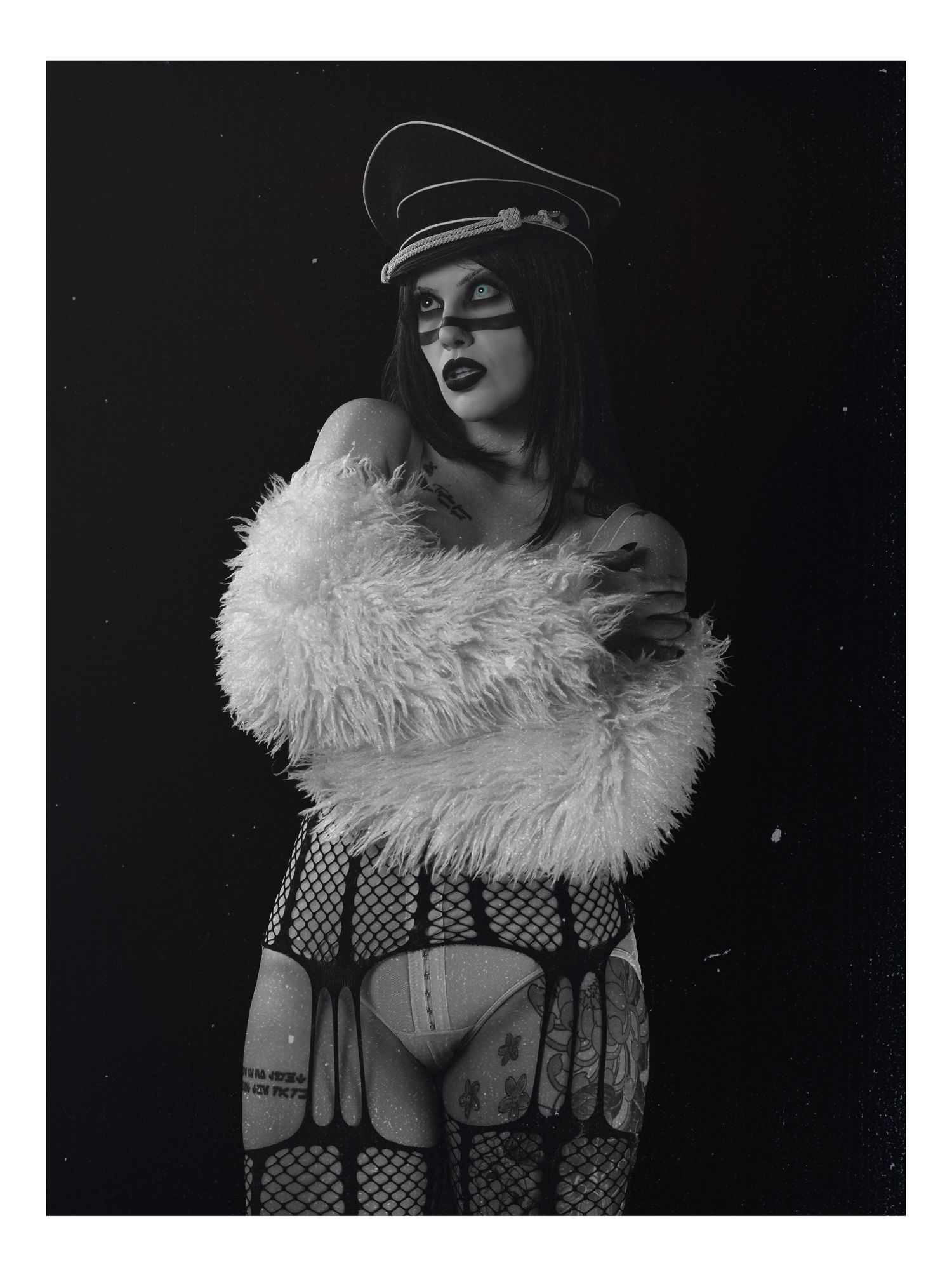 Black and white high-fashion portrait with dramatic lighting, 1990s industrial metal aesthetic, by JRange Photography.