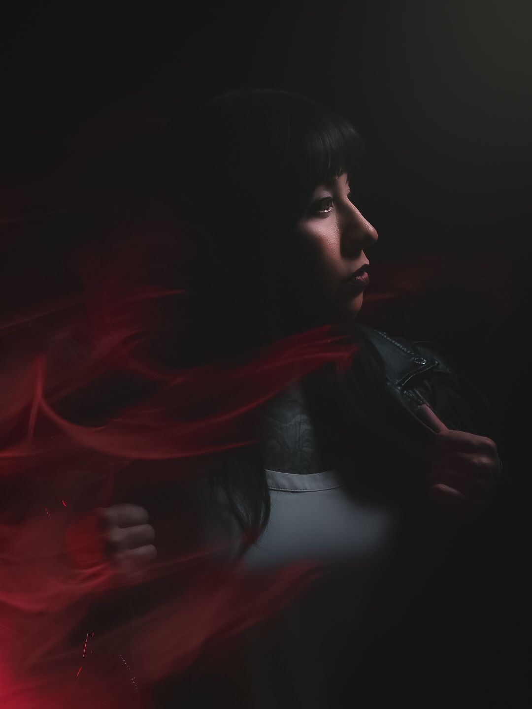A moody, creative self portrait with cinematic lighting.