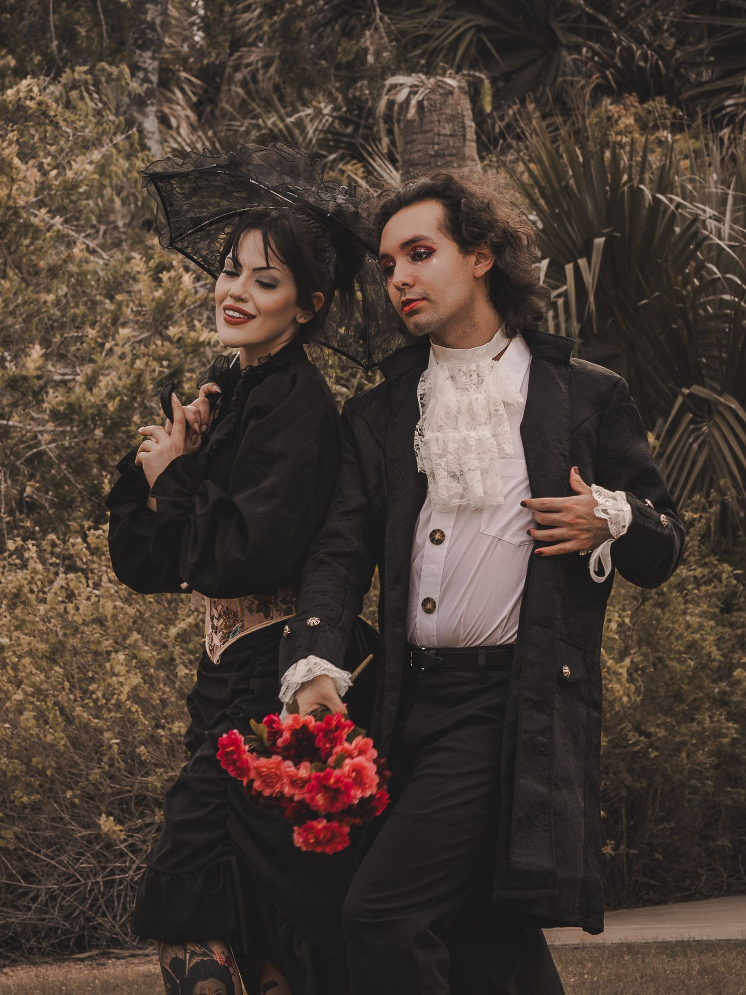 A low-key creative portrait of models with light gothic aesthetic and natural lighting.