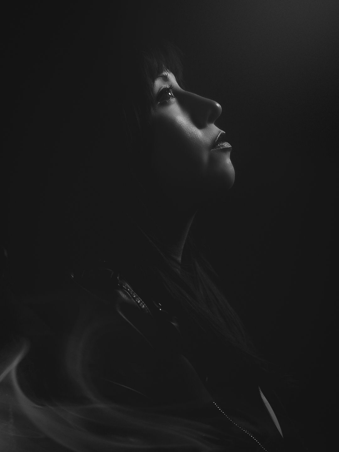 Black and white creative self portrait with cinematic lighting.