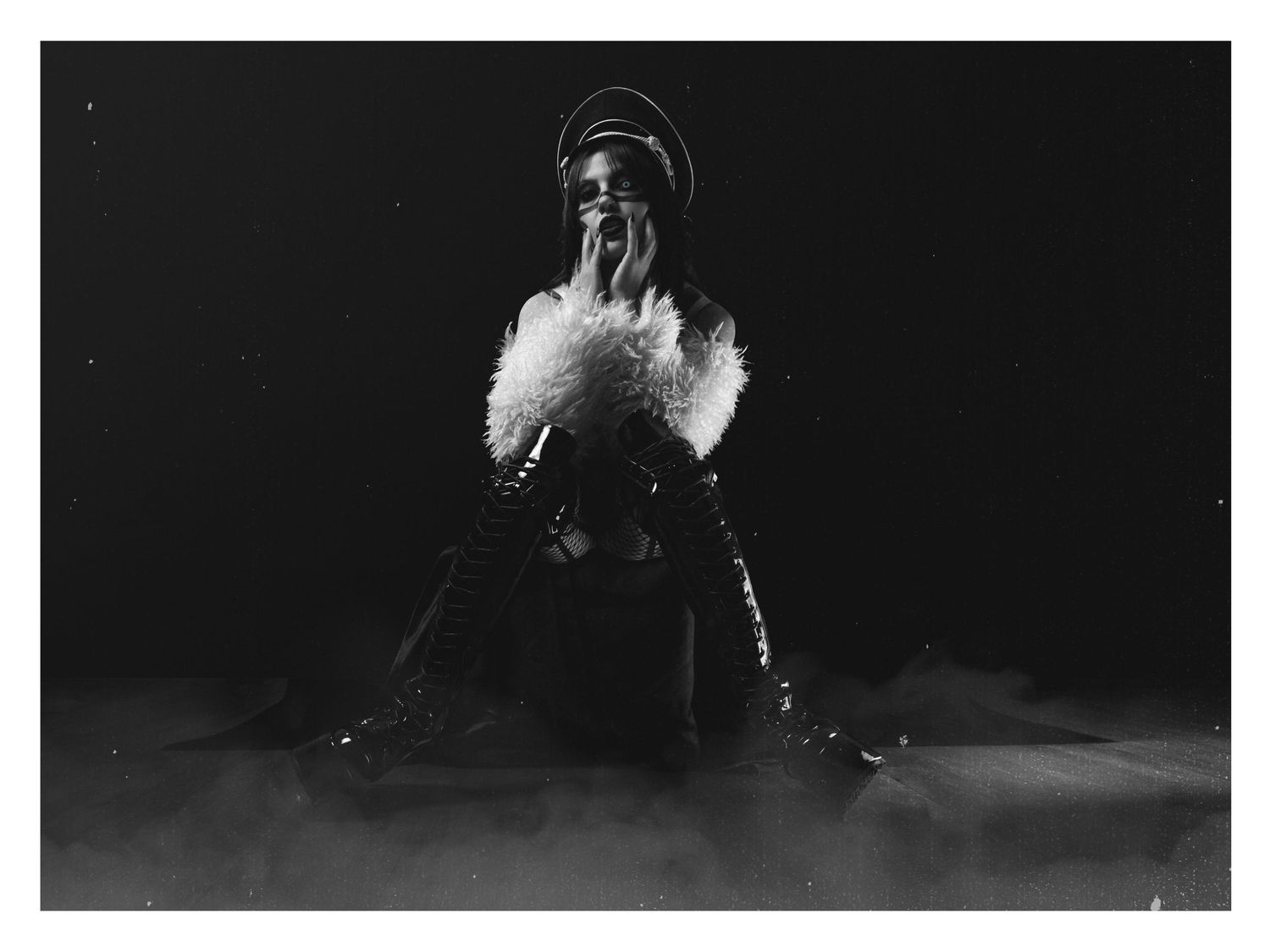 Black and white high-fashion portrait with dramatic lighting, 1990s industrial metal aesthetic, by JRange Photography.