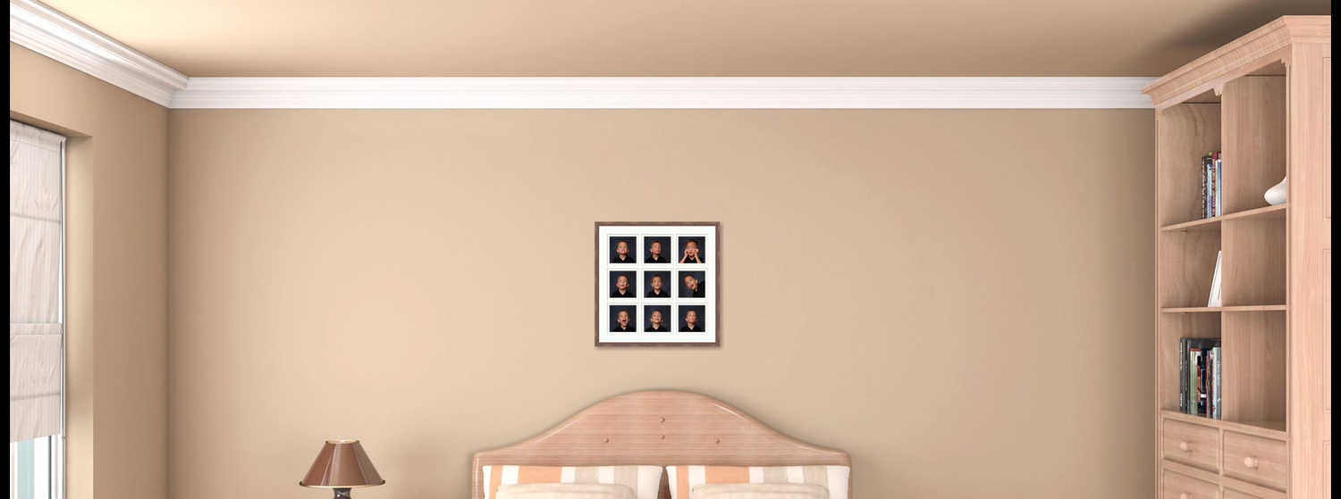 Child's room with a framed 9 series of the child.