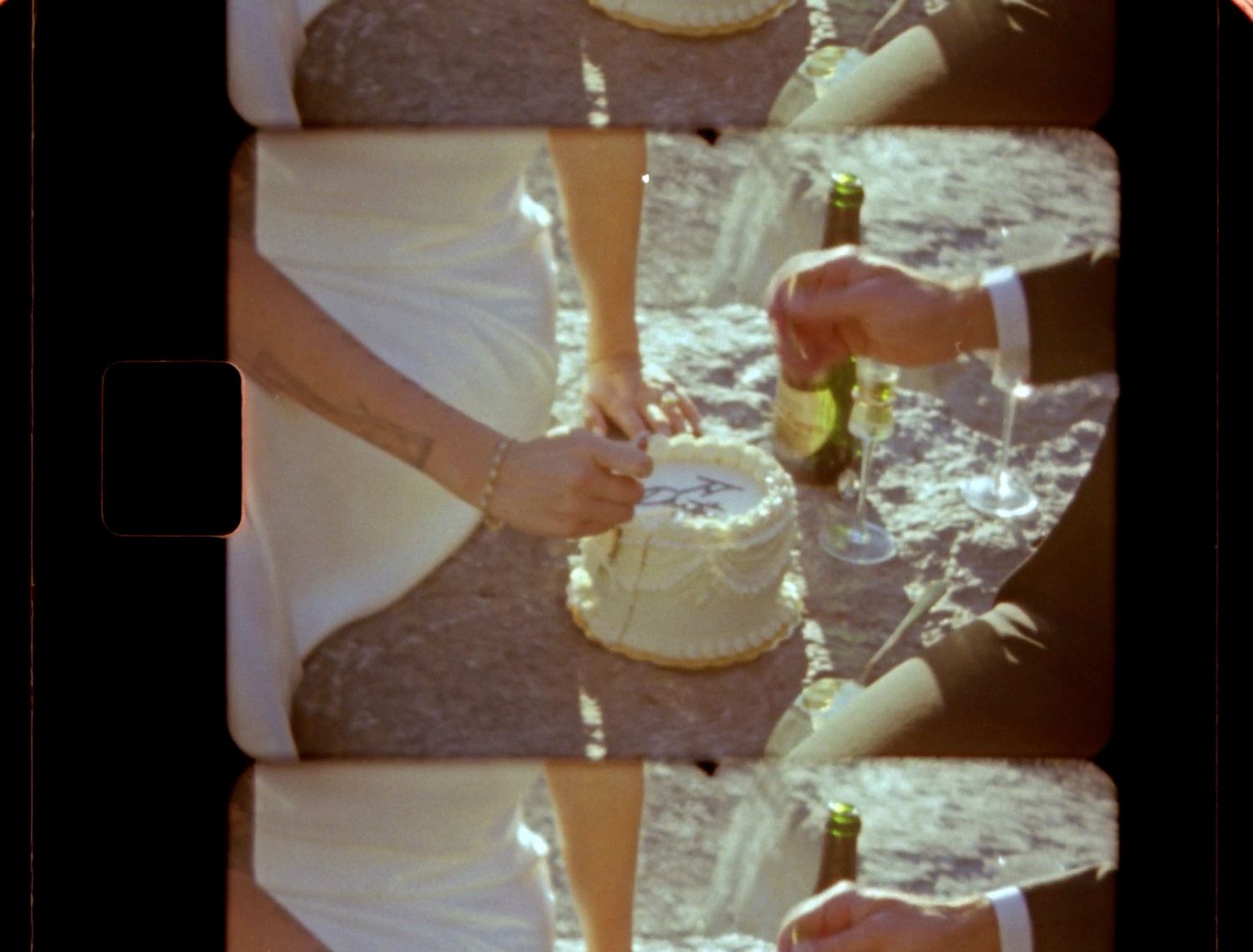 super 8 still of couple eating cake in glacier national park