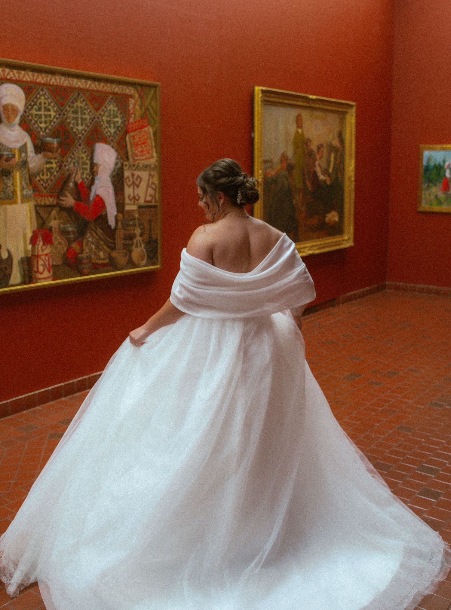 bride in utah at the springville art museum spins in front of paintings