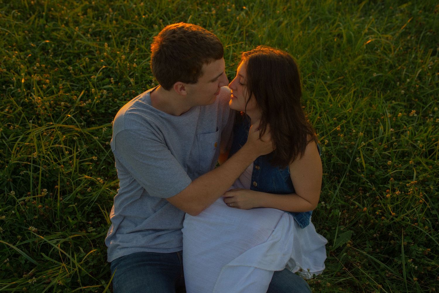 35mm film of young adventurous couple holding each other during sunset