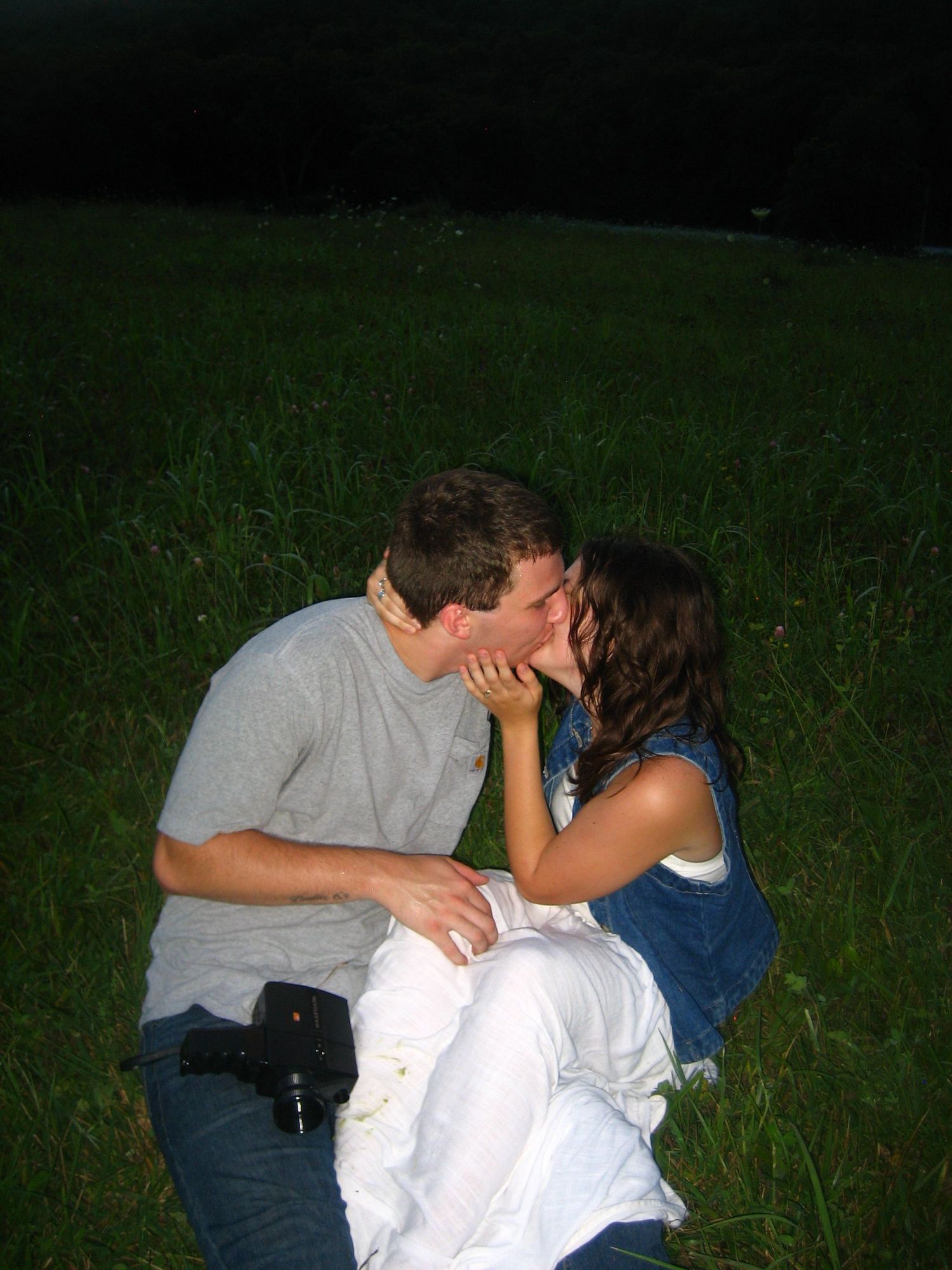flash 35mm film of couple kissing with super 8 camera