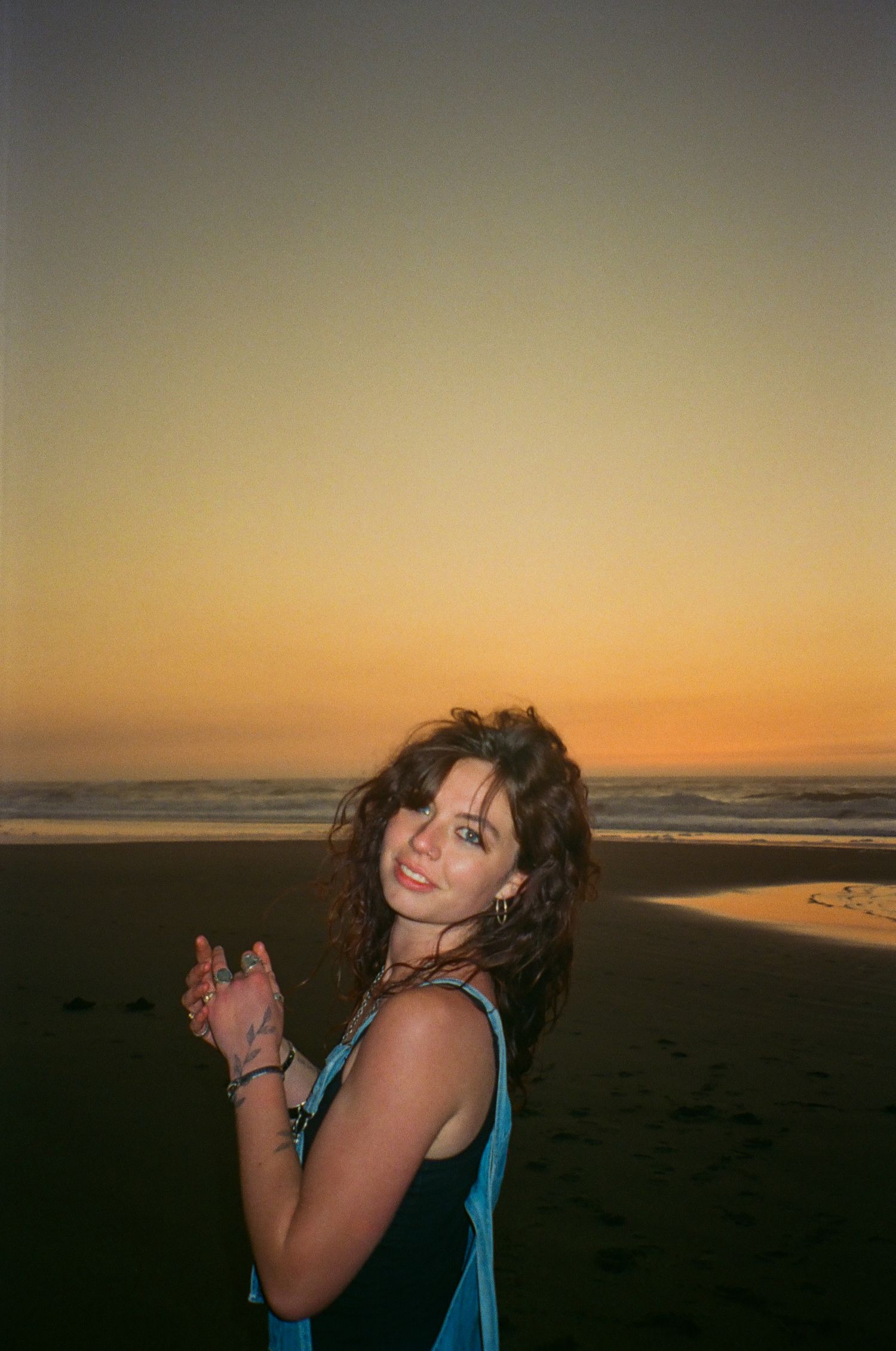 girl poses on flash film in oregon coast