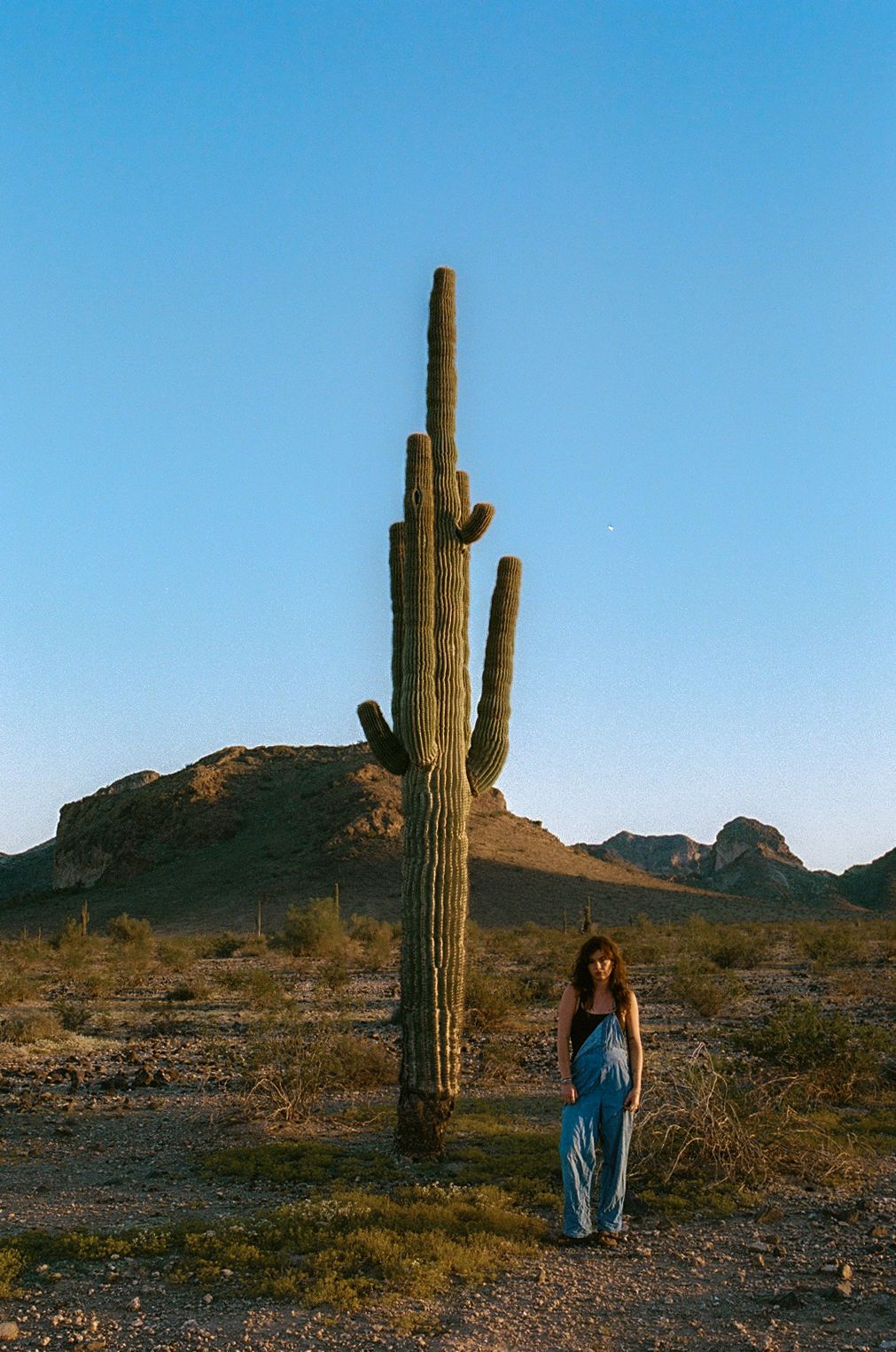 35mm film of girl in front of cactus in arizona desert