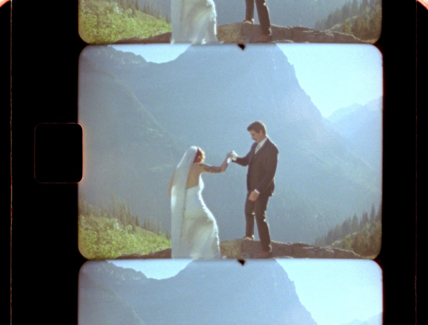 super 8 still of couple embracing in glacier national park at logan's pass