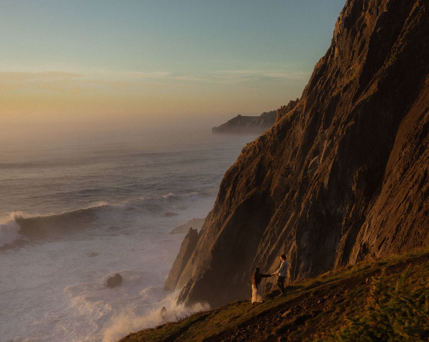 couple explores on oregon coast during sunset at elk flats