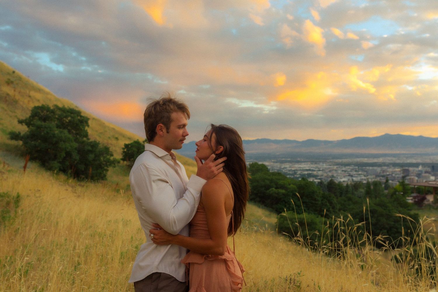 utah couple hugs at sunset in the mountains of salt lake city