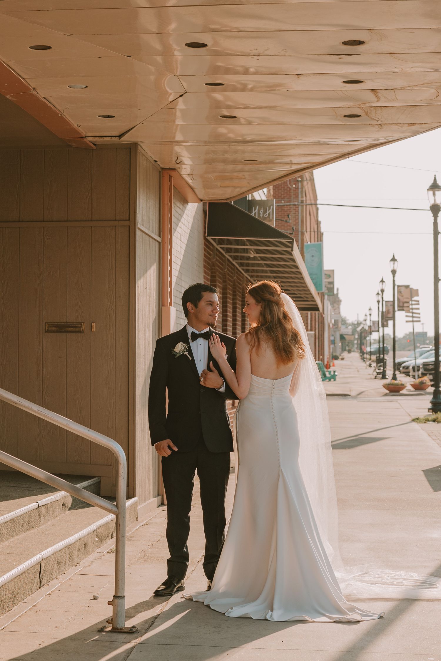 wedding couple portraits in downtown Denison, TX at sunset