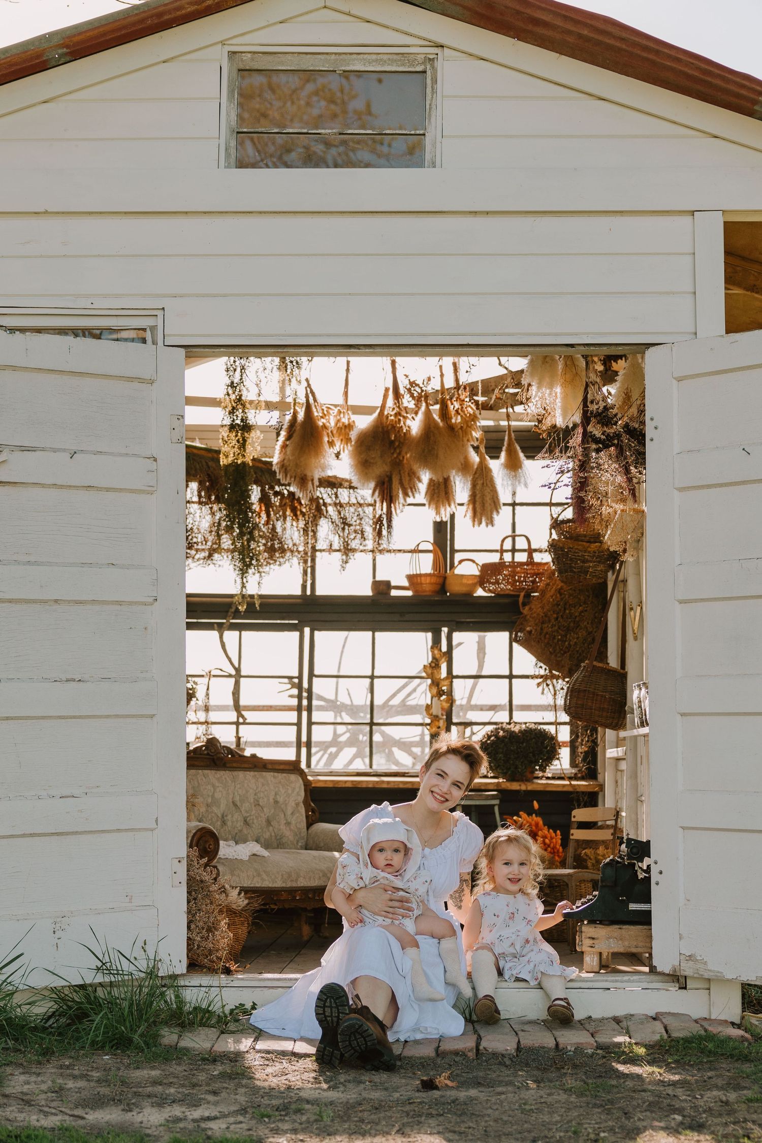 lifestyle family session at golden hour at the Glass Shack in Howe, TX