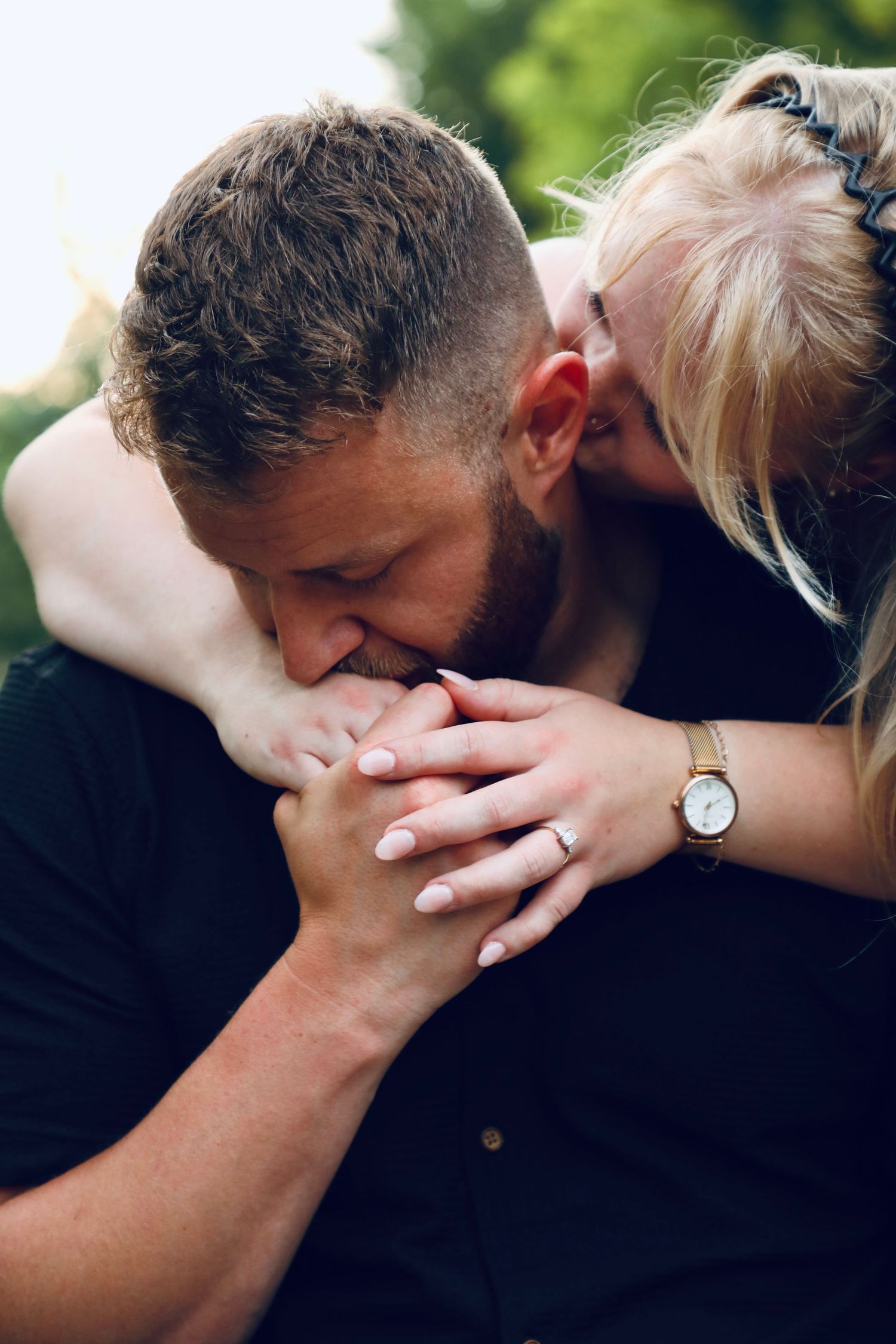 A romantic couple sharing intimate kisses in a sequence of black and white close-up shots.