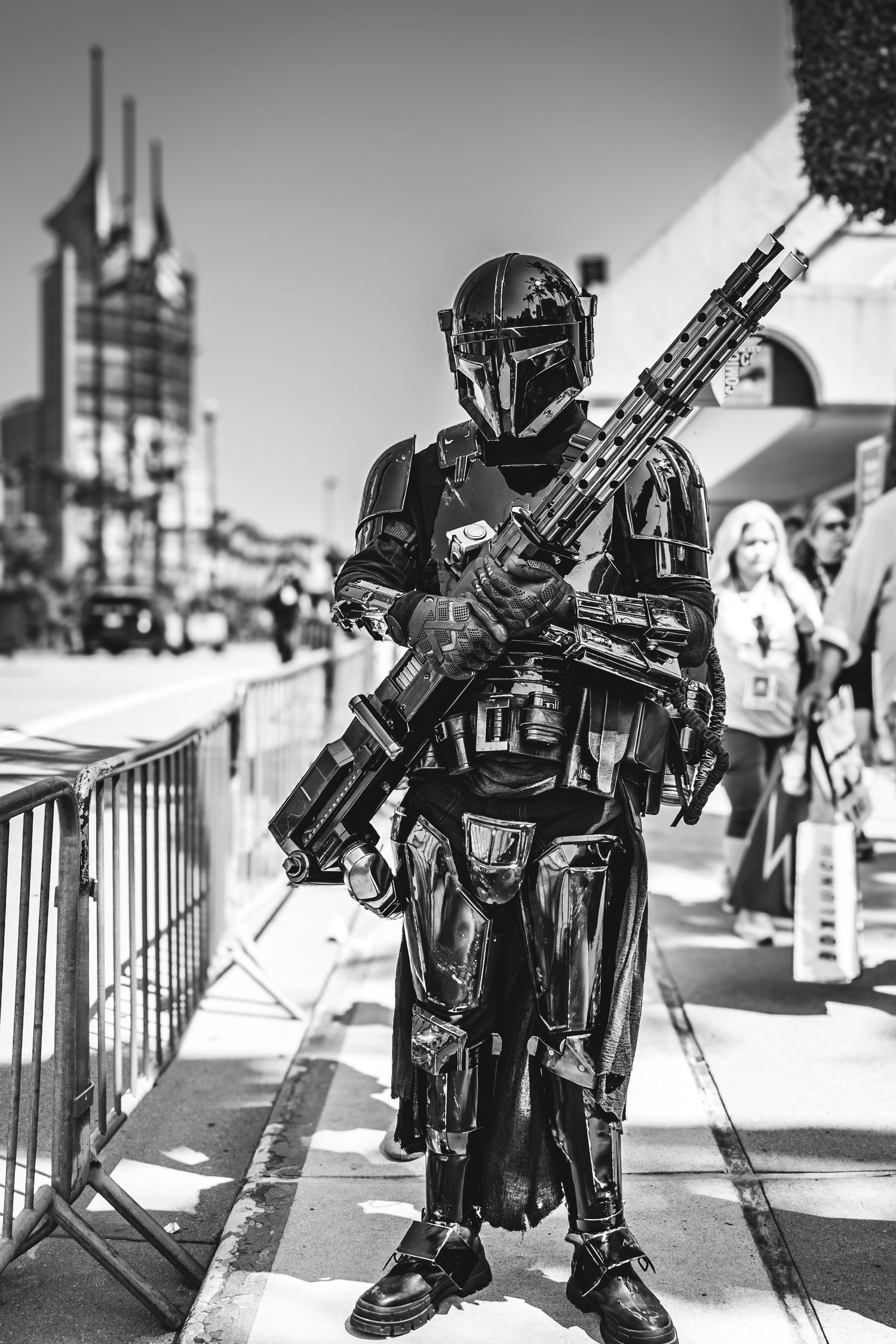 Black and white photos of costumed Star Wars characters posing with prop weapons at an event.