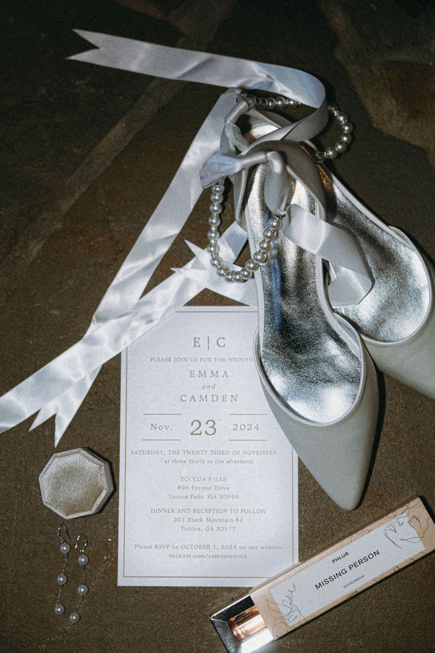 Fine Art Wedding Photography of high-end bridal details: invitation suite, ribbon, and luxury silver wedding shoes.