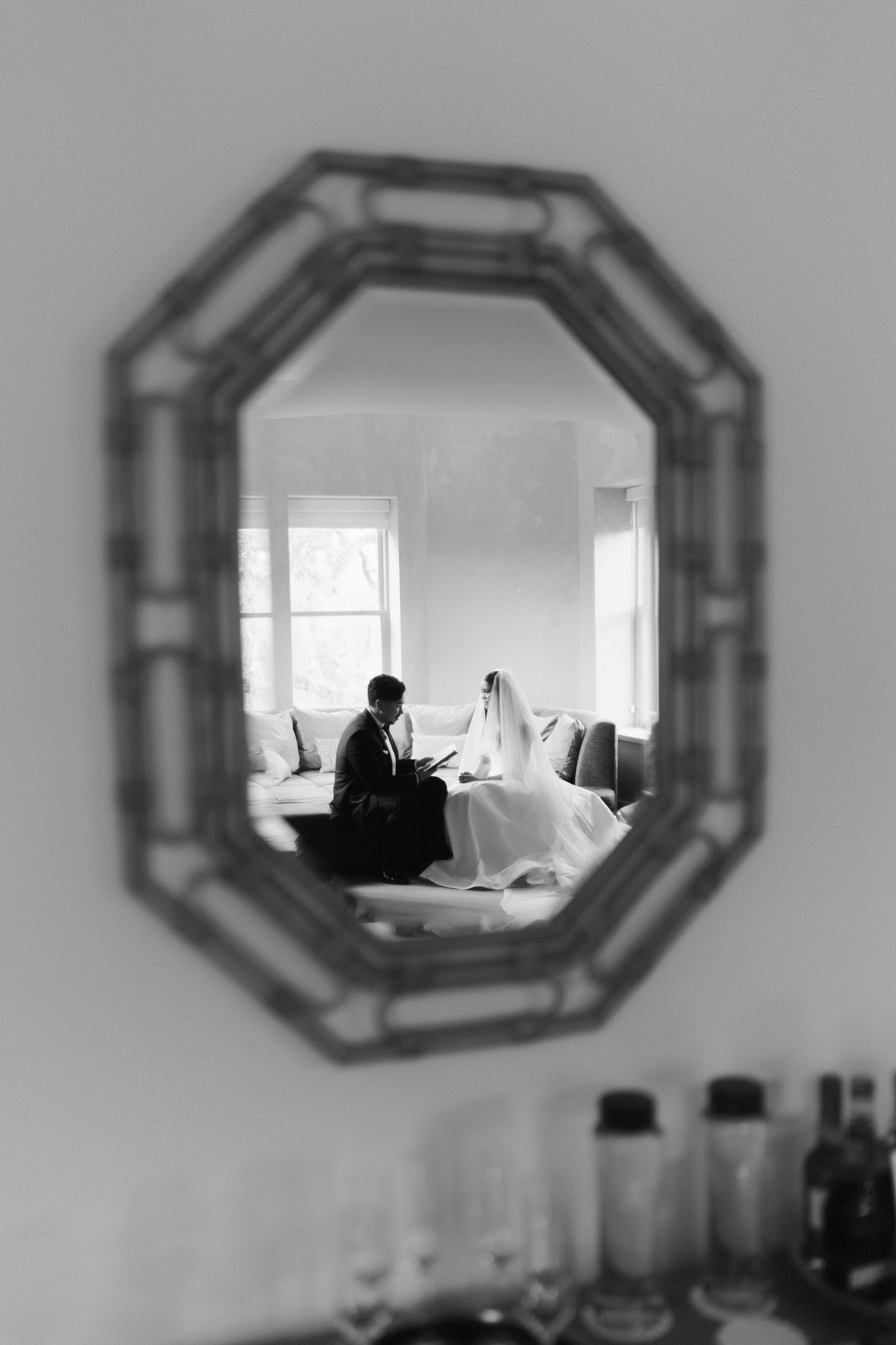A series of decorative octagonal mirrors mounted on a light gray wall.