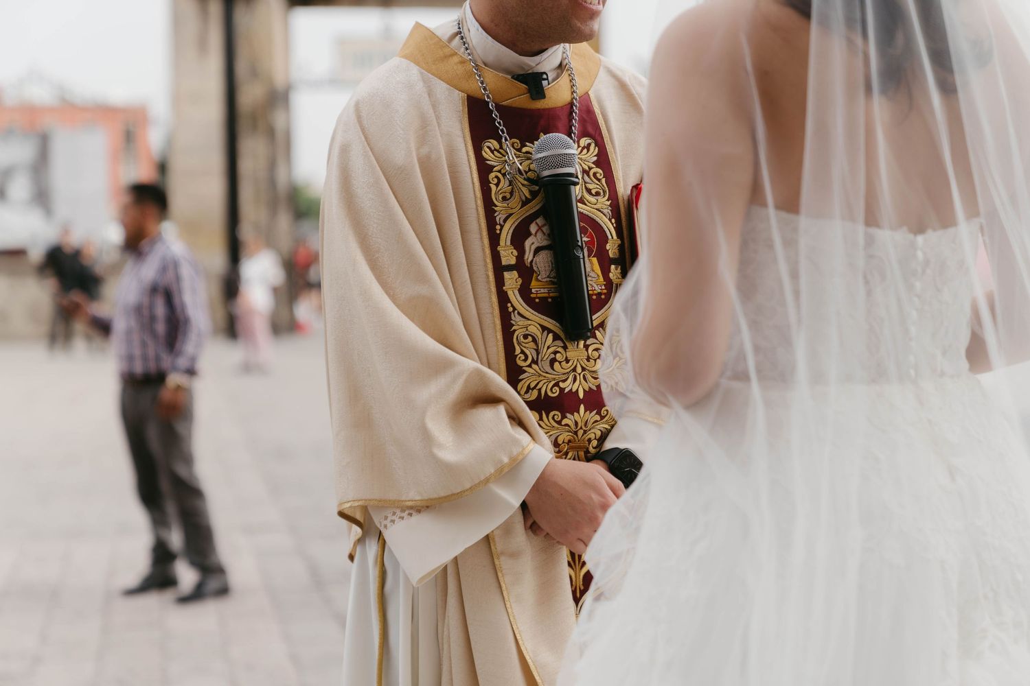 Elegant white wedding veil detail with ornate lace trim.