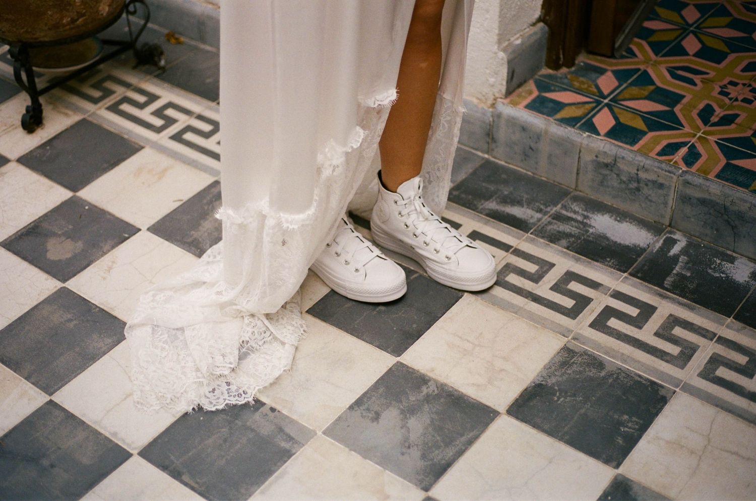Detailed view of a black and white checkered floor with ornate border patterns.