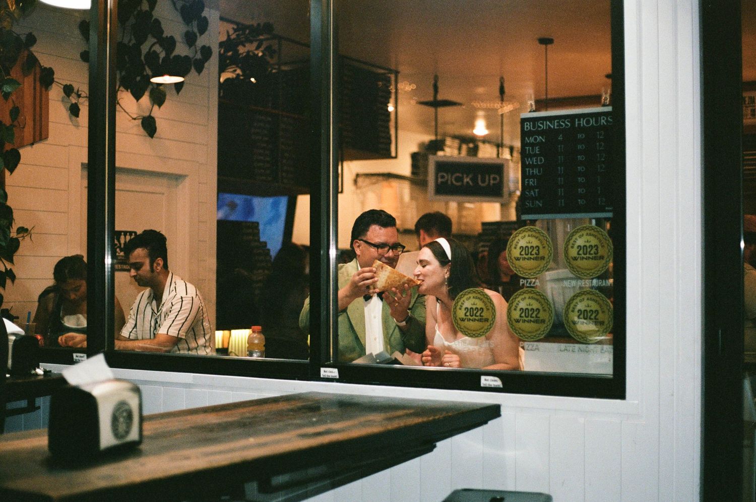 View through a window of a restaurant or bar interior.