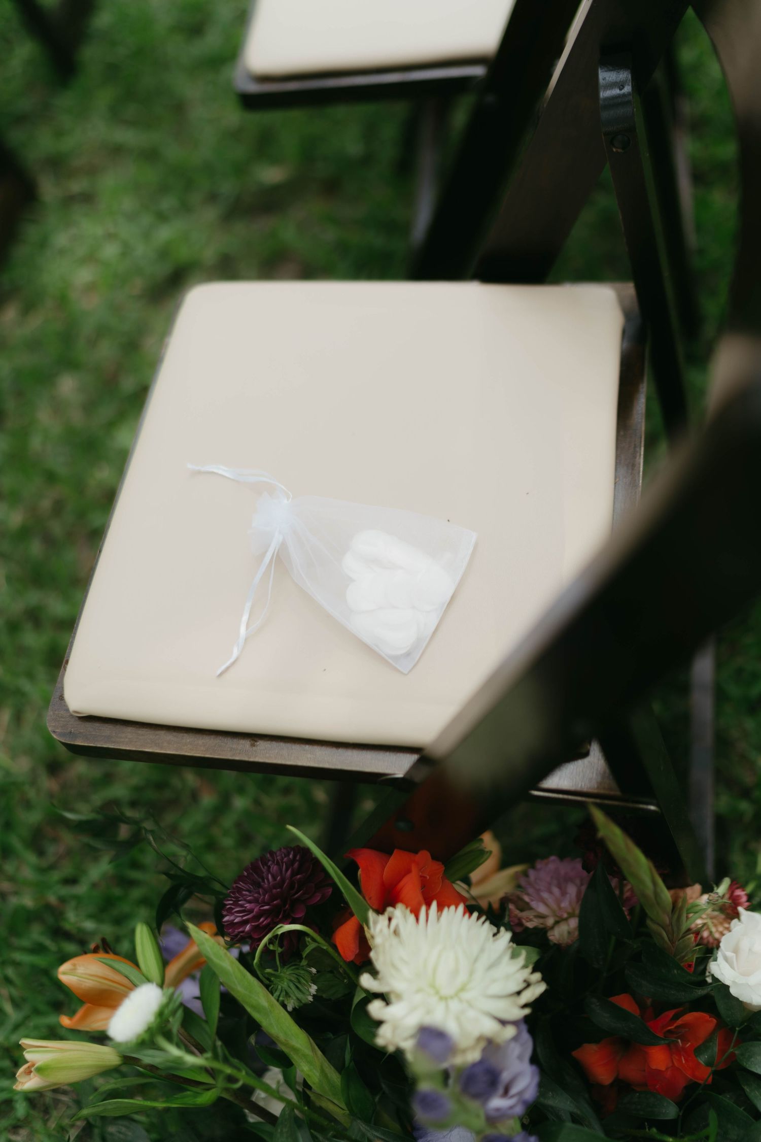 Colorful floral arrangements with white and red blooms decorate a light-colored surface.