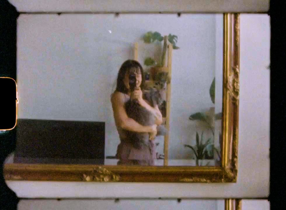 Elegant gold-framed mirrors line a white wall in sequence.