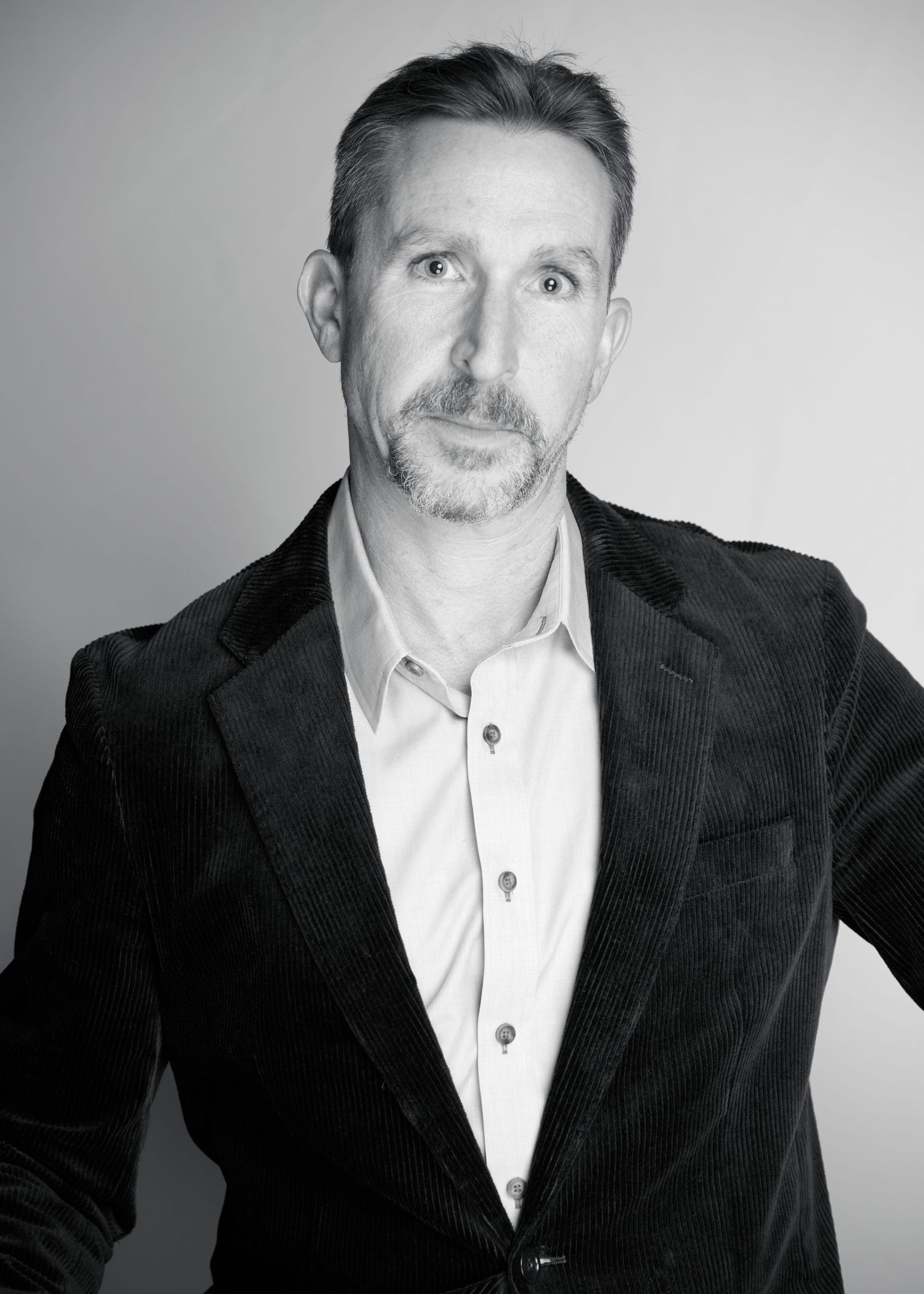 Black and white professional headshots showing various poses in business attire.