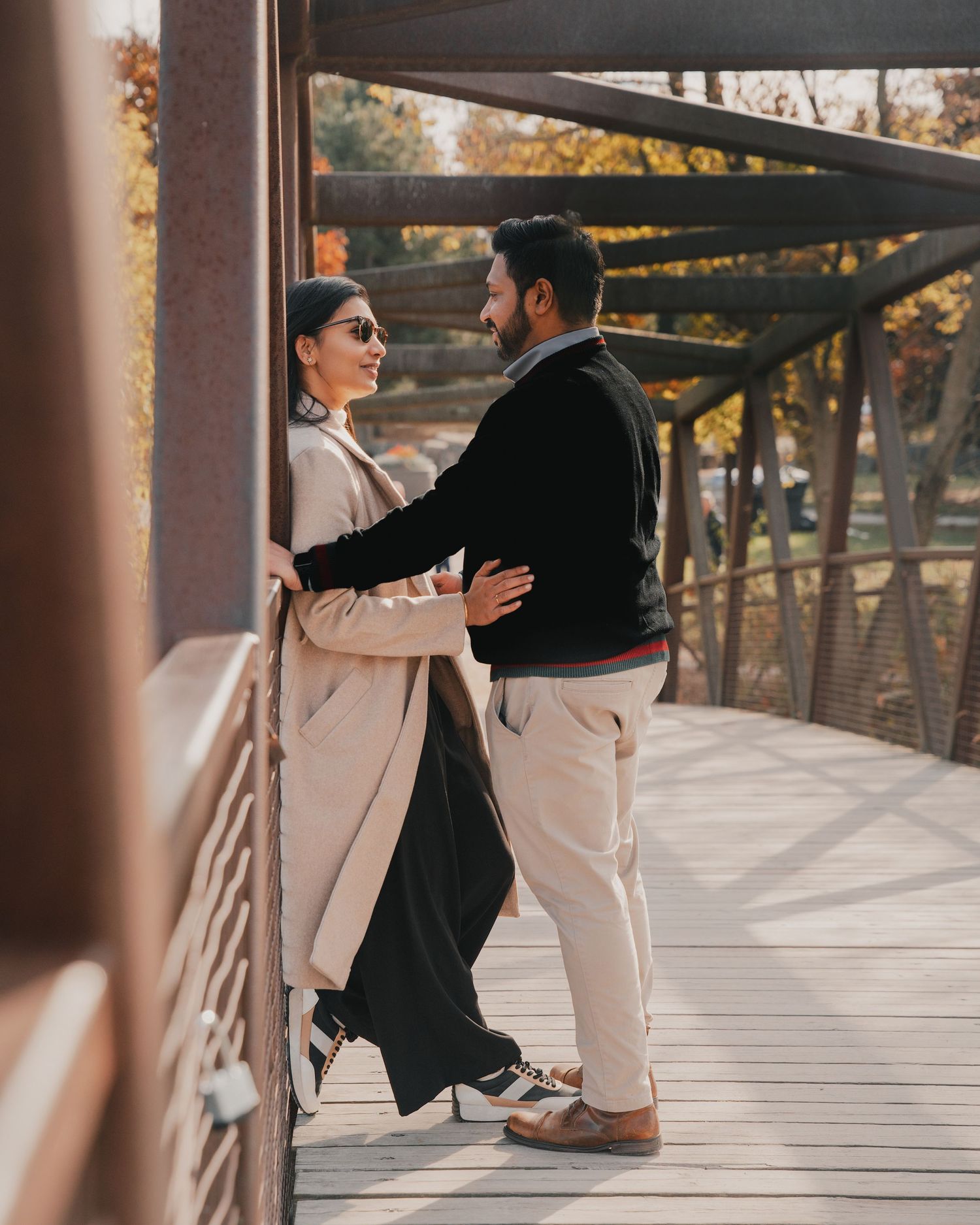 Couple holding hands during outdoor engagement session in Mississauga