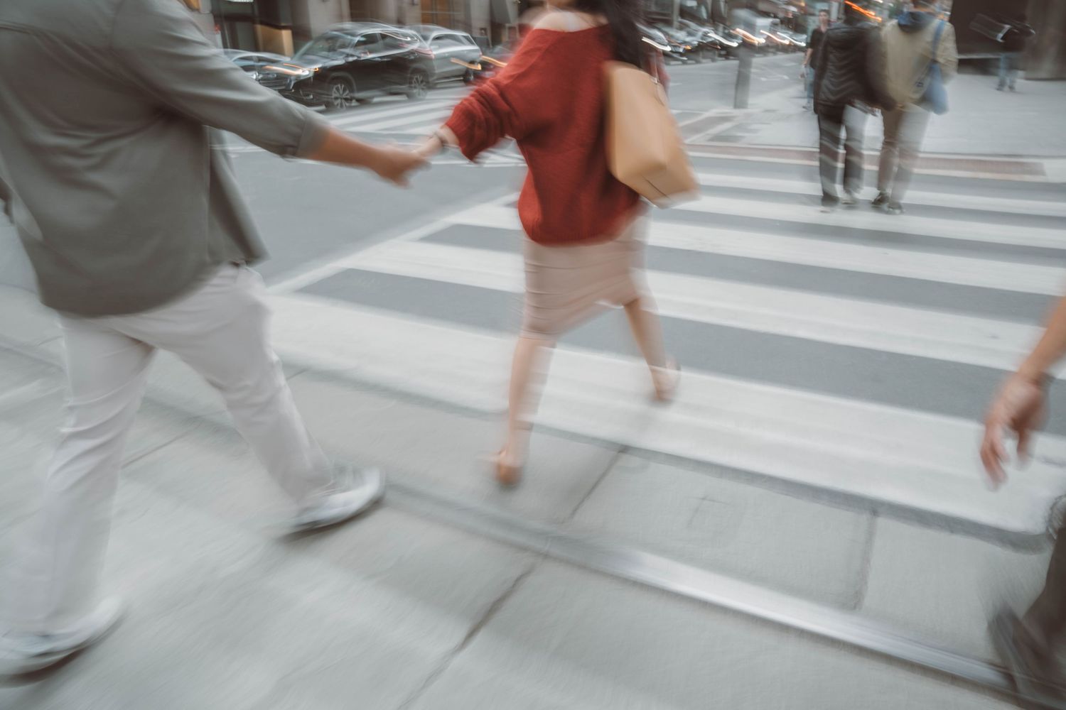 Couple holding hands during outdoor engagement session in Toronto