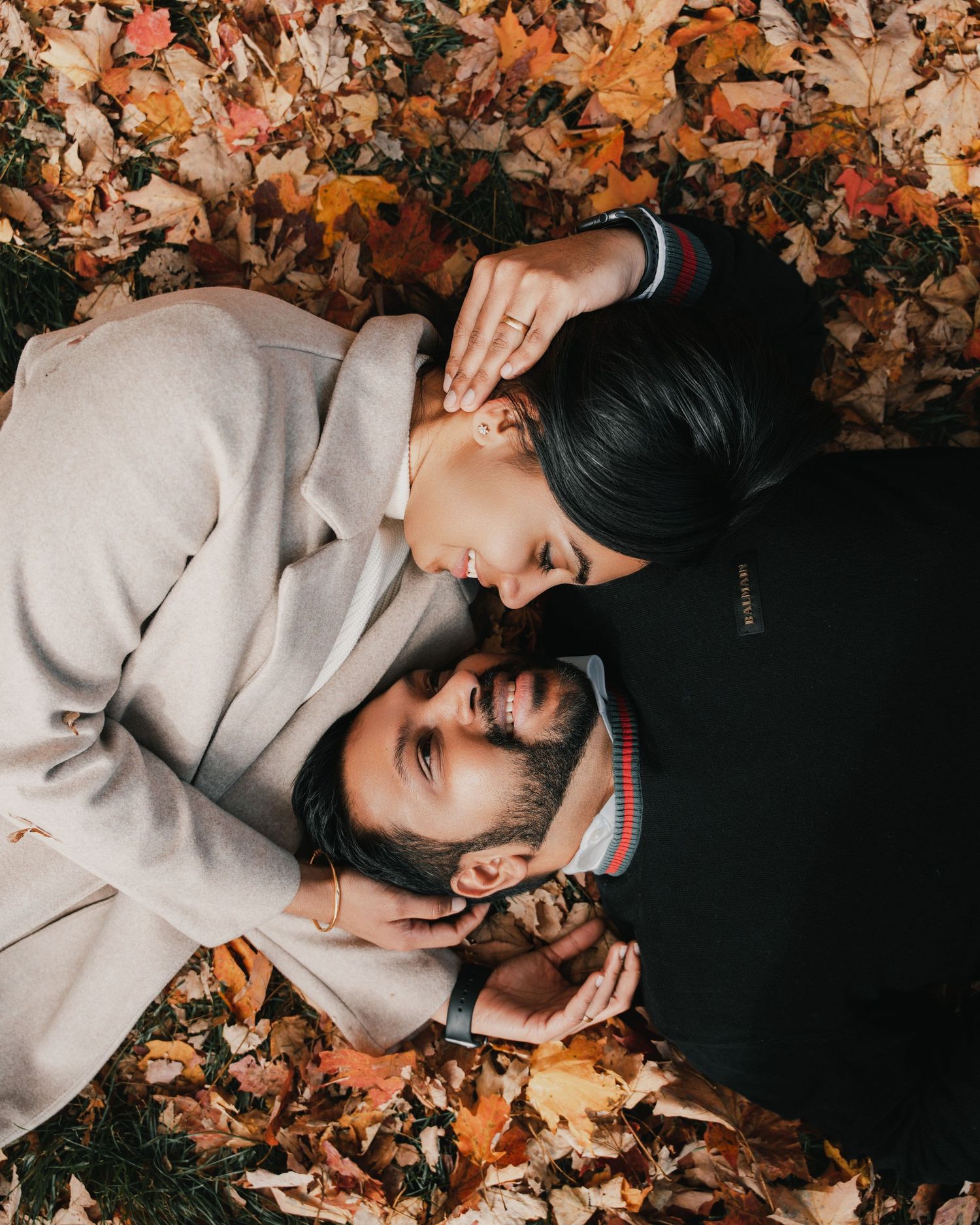 Couple holding hands during outdoor engagement session in Mississauga
