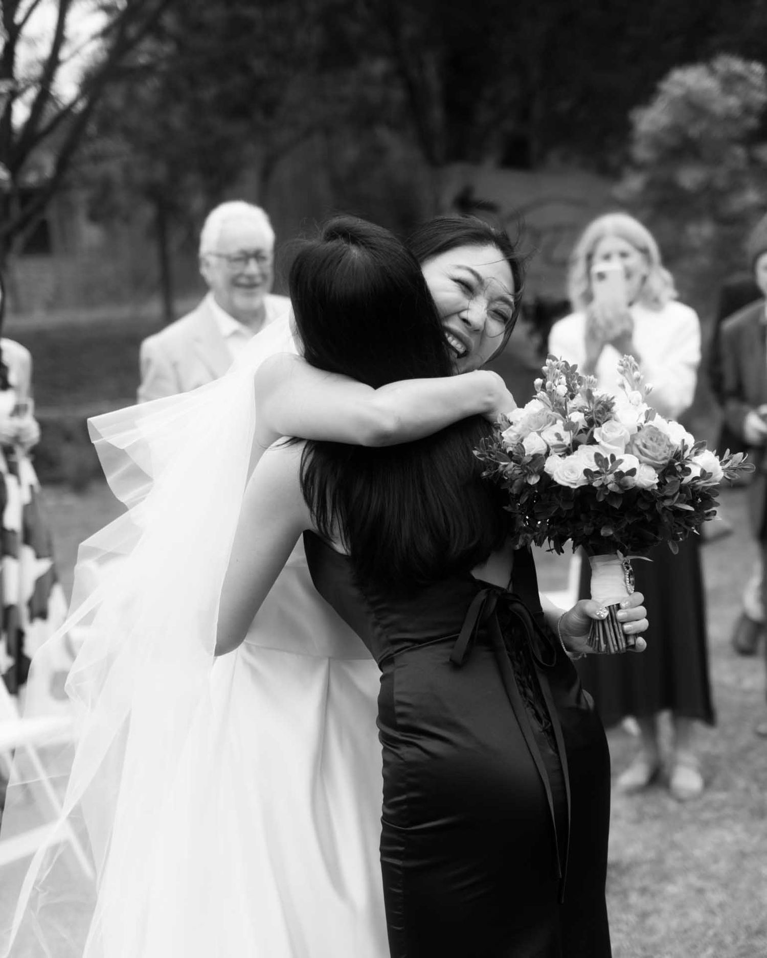 Bride hugs her sister after walking down the isle for her wedding in Tanunda by Barossa Valley photographer Matt Webster