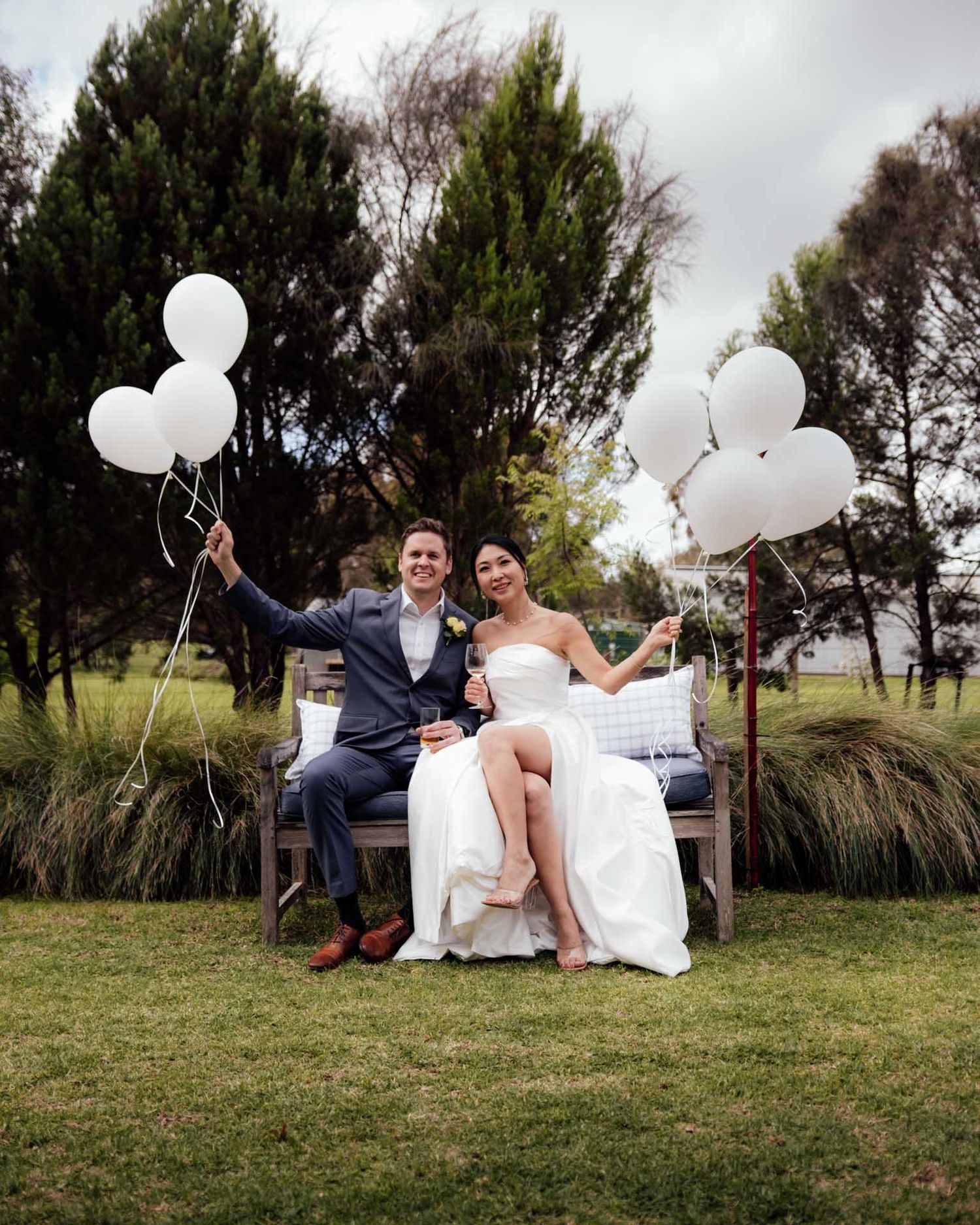 Married couples holding balloons after their wedding Tanunda, photographed by Barossa Valley wedding photographer Matt Webster