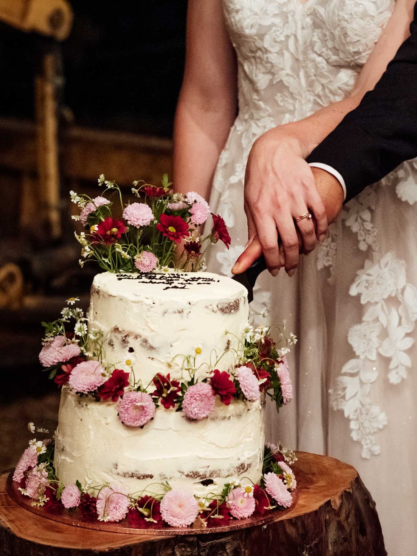 Bride and grooms hands cutting their wedding cake in the Adelaide Hills, photographed by Barossa Valley wedding photographer Matt Webster.