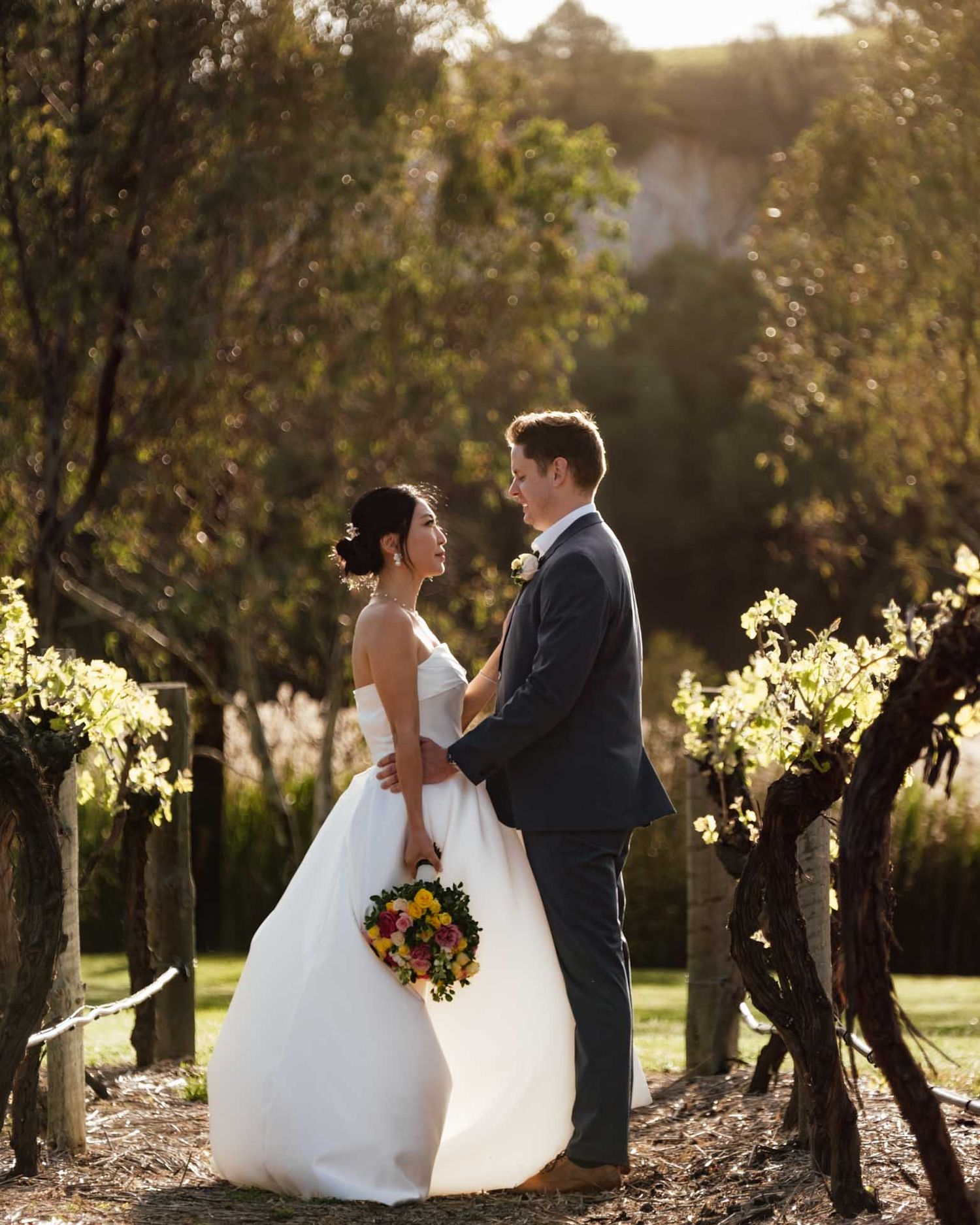 Vineyard portrait of newly married couple during golden hour in Tanunda, captured by Barossa Valley photographer Matt Webster