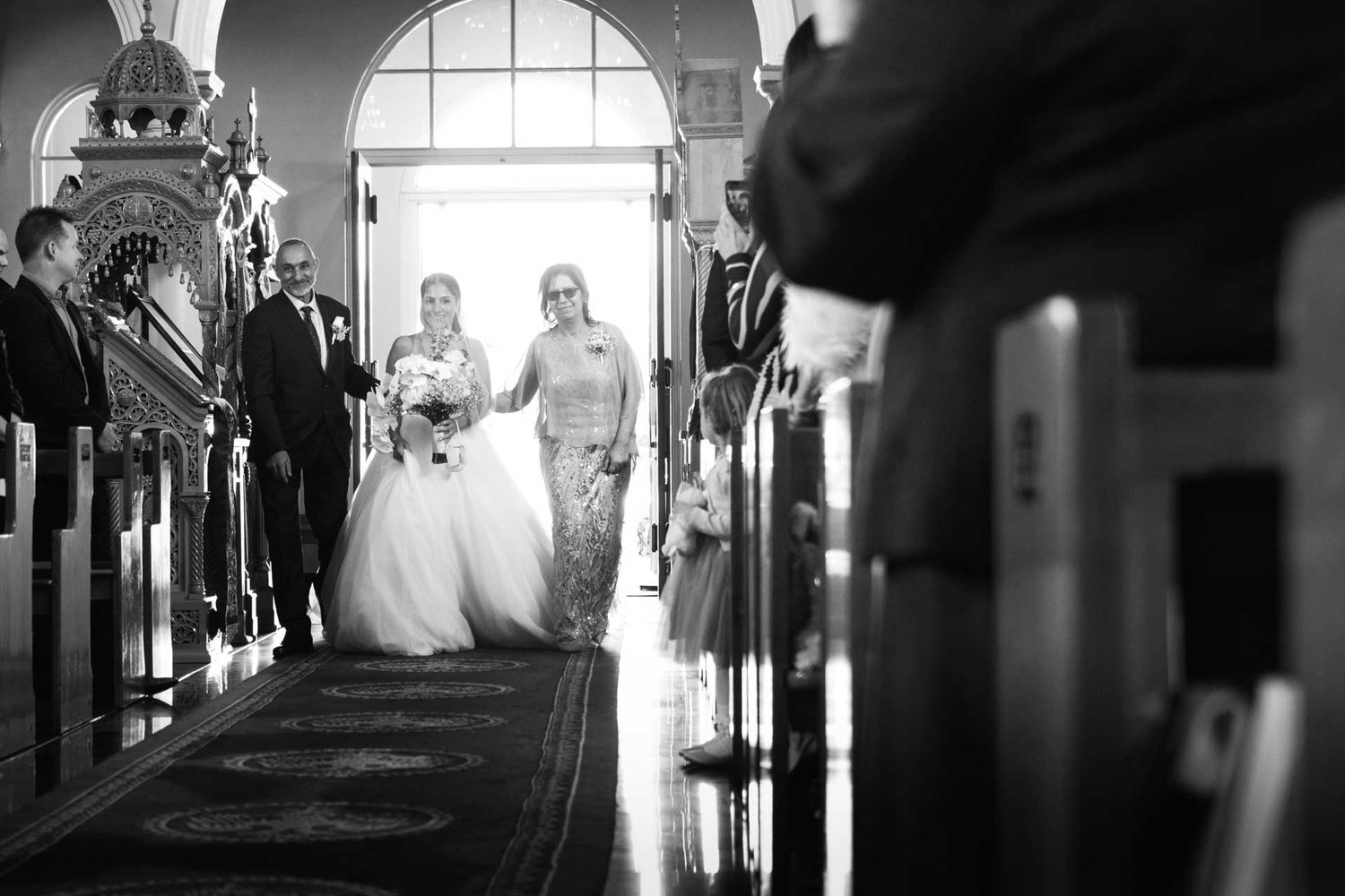 Bride walking down the isle of St George Orthodox Church, Thebarton wedding, captured by Matt Webster.