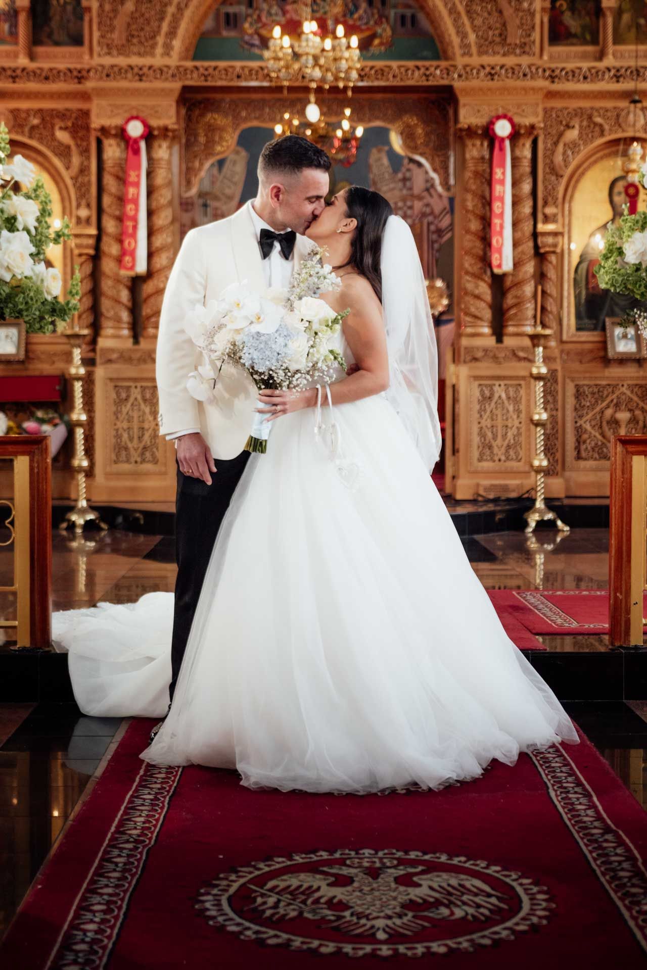 Bride and groom during their wedding at St George Greek Orthodox Church, photographed by Barossa Valley wedding photographer Matt Webster.