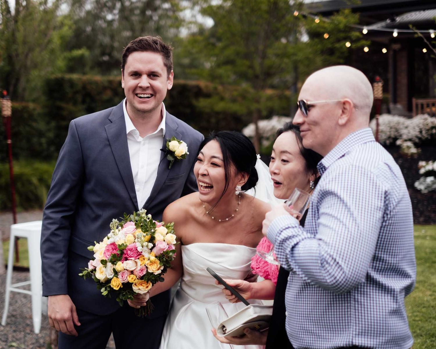 Bride and groom laughing with guests at their outdoor wedding in Tanunda by Barossa Valley photographer Matt Webster