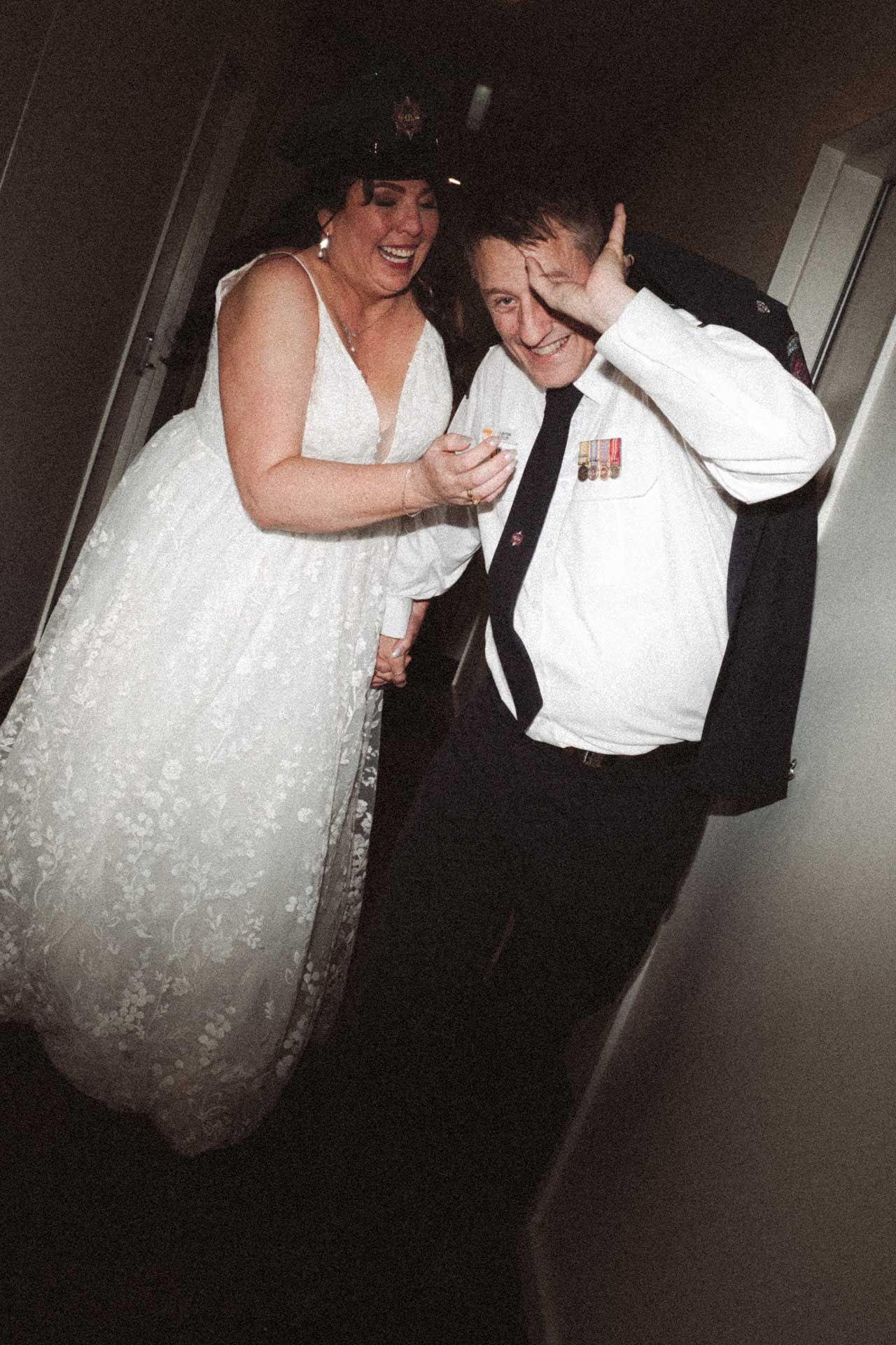 Bride and groom run away from the camera at wedding reception at Sfera's Modbury, captured by Barossa Valley photographer Matt Webster.