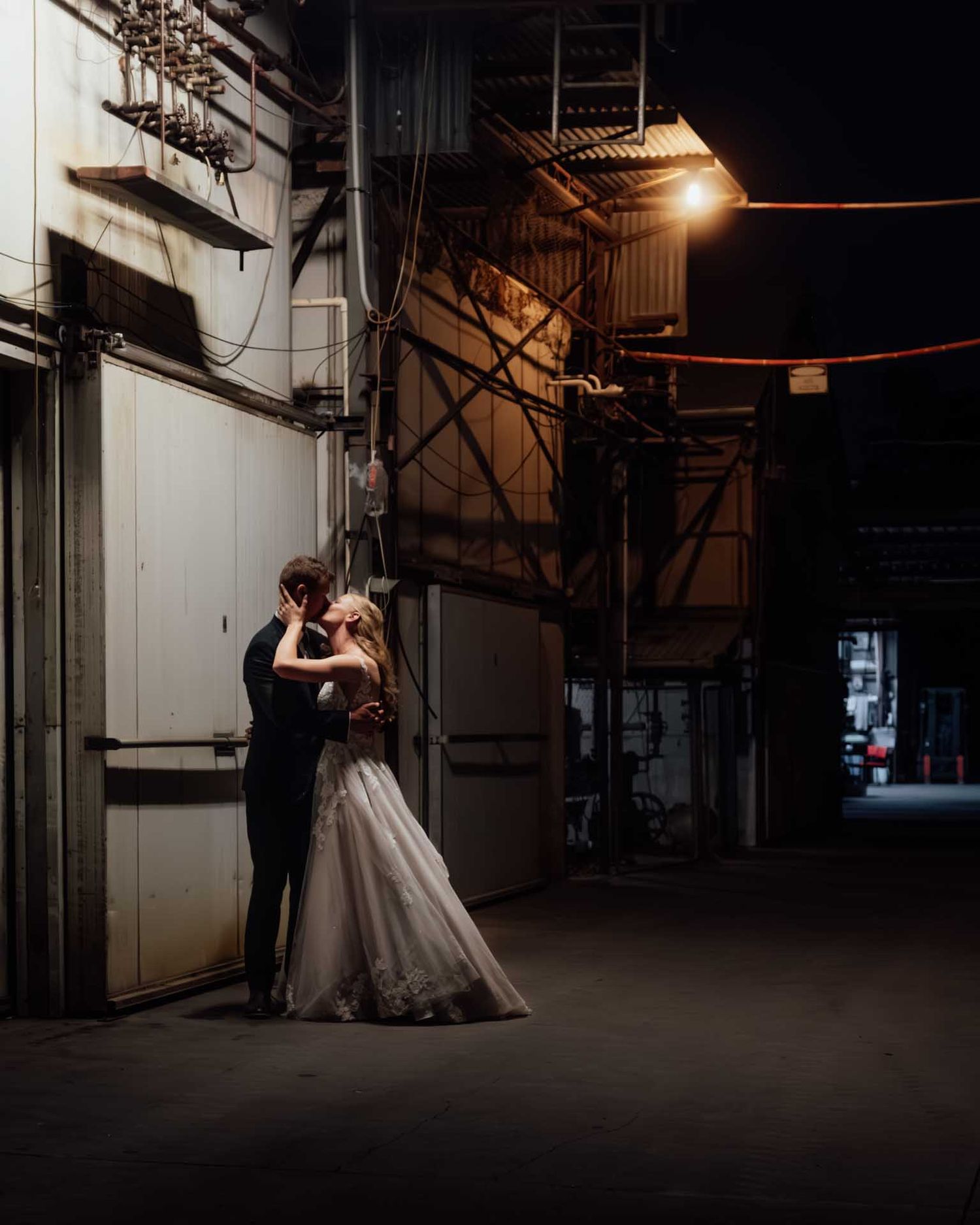 Bride and groom kiss under streetlight at an Adelaide Hills orchid, photographed by Barossa Valley wedding photographer Matt Webster.