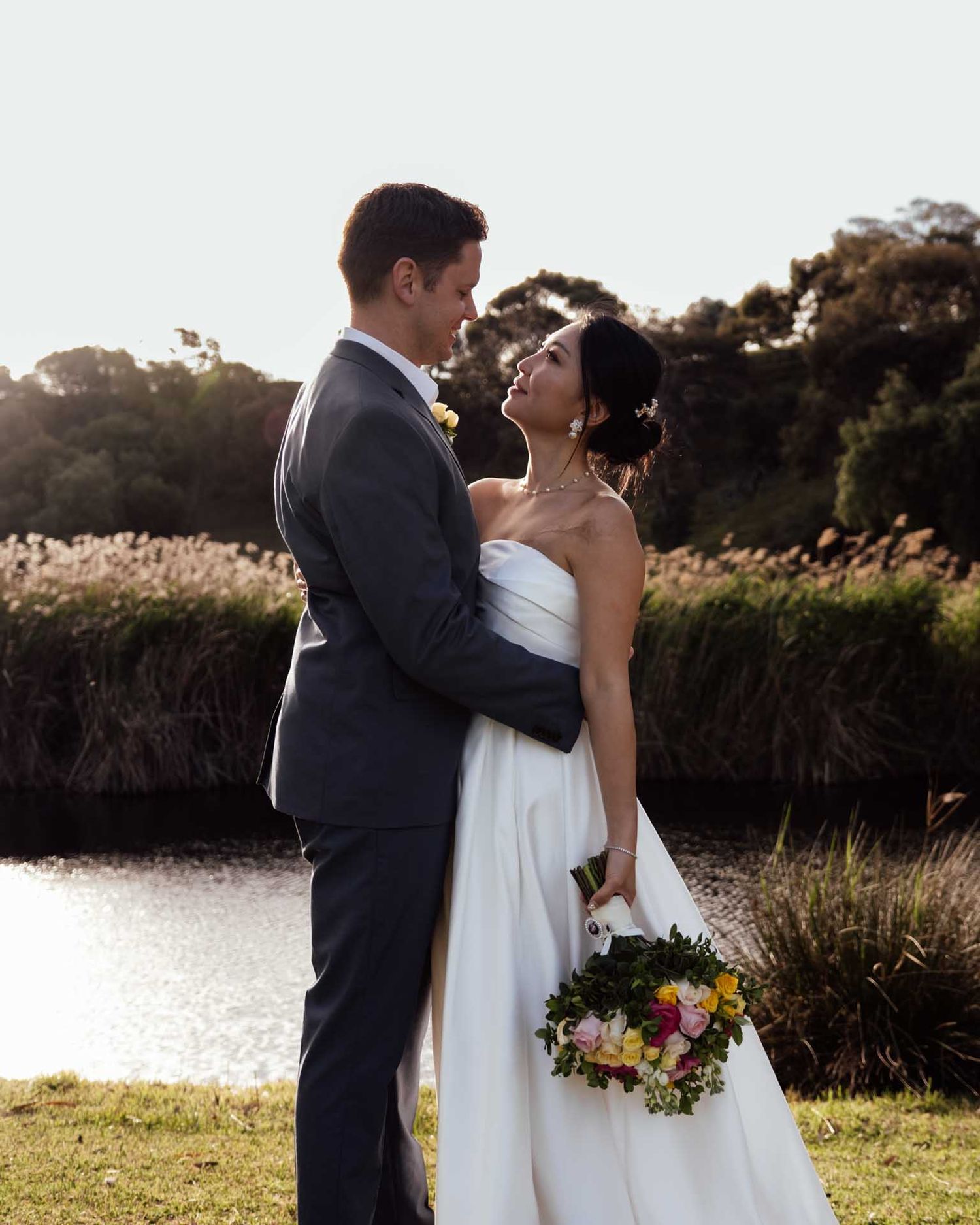 South Australian wedding portrait of a couple standing by the river in Tanunda, captured by Barossa Valley photographer, Matt Webster.