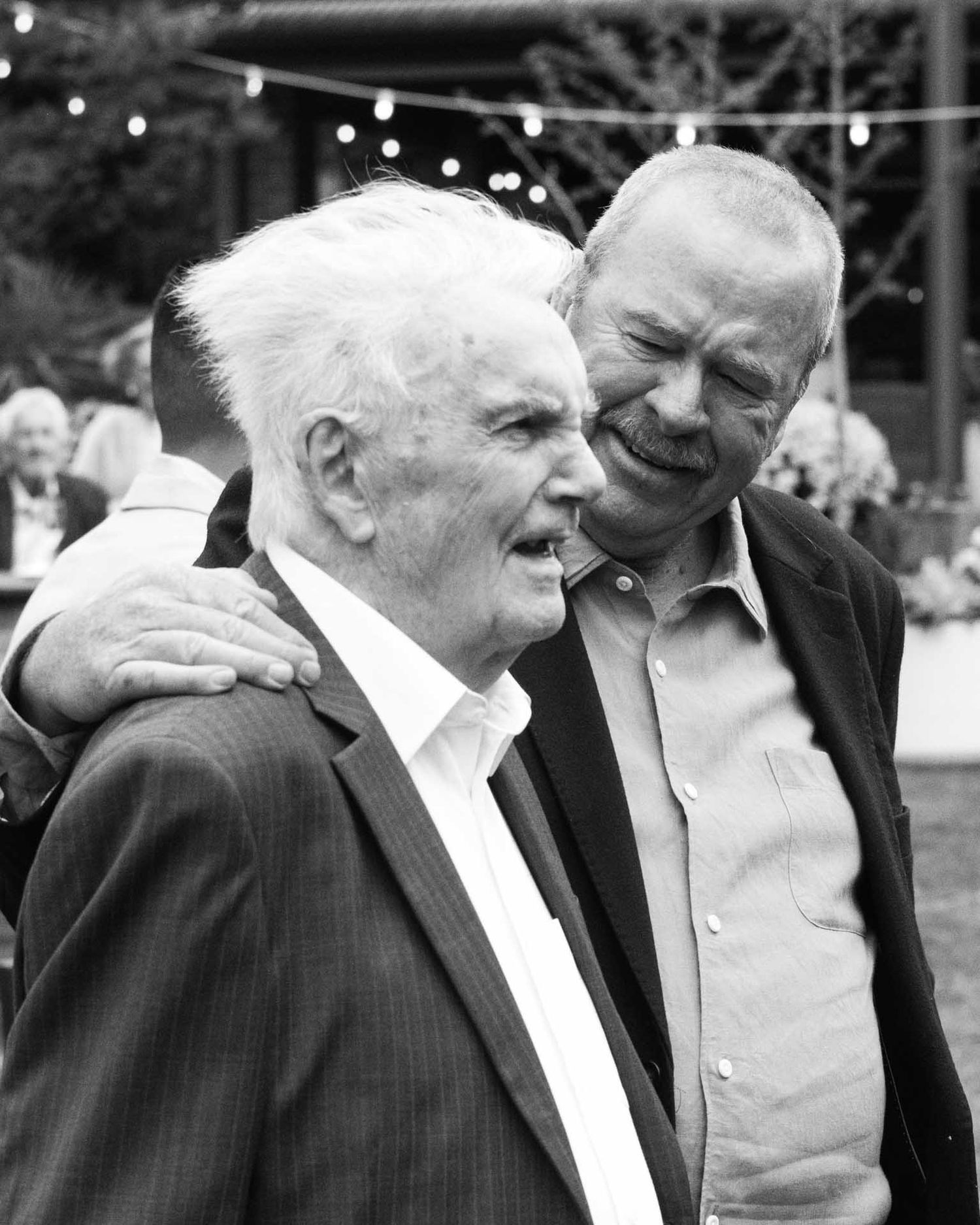 Candid moment of guest and his father during an outdoor wedding reception in Tanunda by Barossa Valley photographer Matt Webster