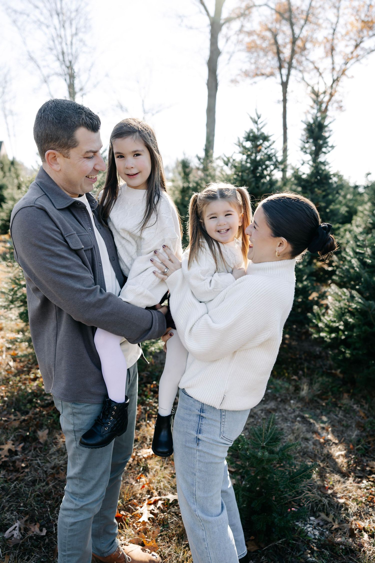 Candid family moments captured in a series of playful interactions outdoors.