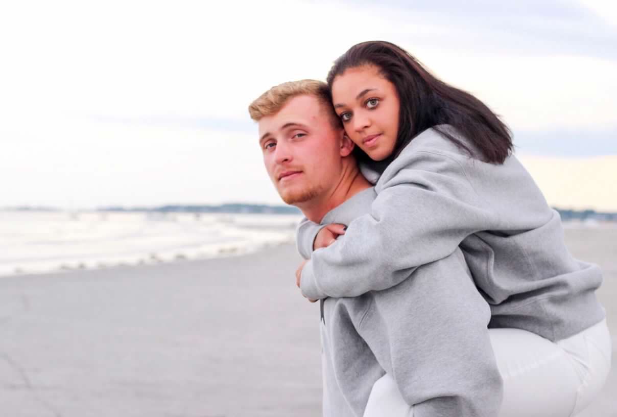 Sweet candid moments captured during a beachside couple's photoshoot.