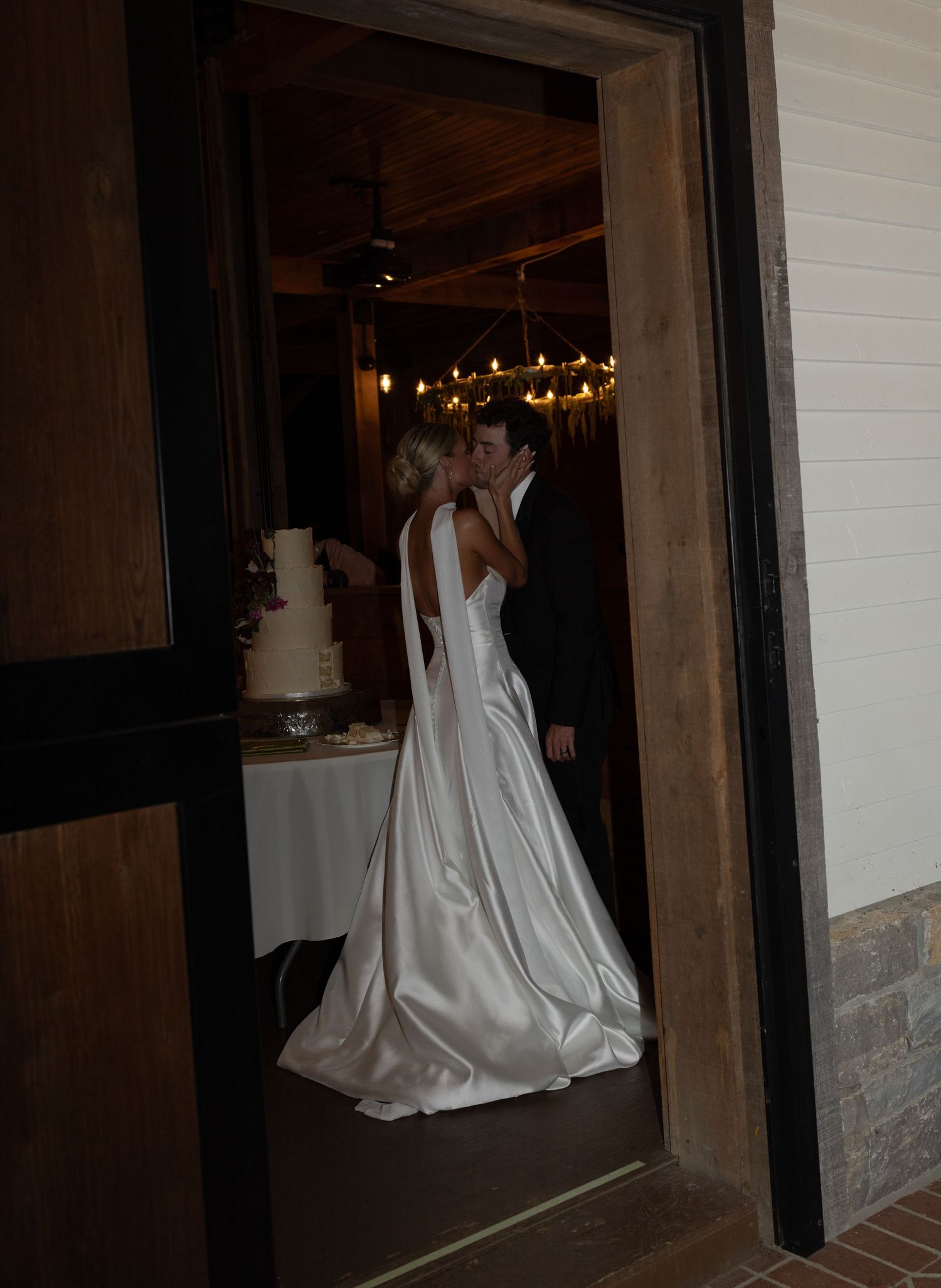 A sweet kiss tender kiss after the cake was cute. Beautiful venue in Franklin Tennessee Trinity View Farm.