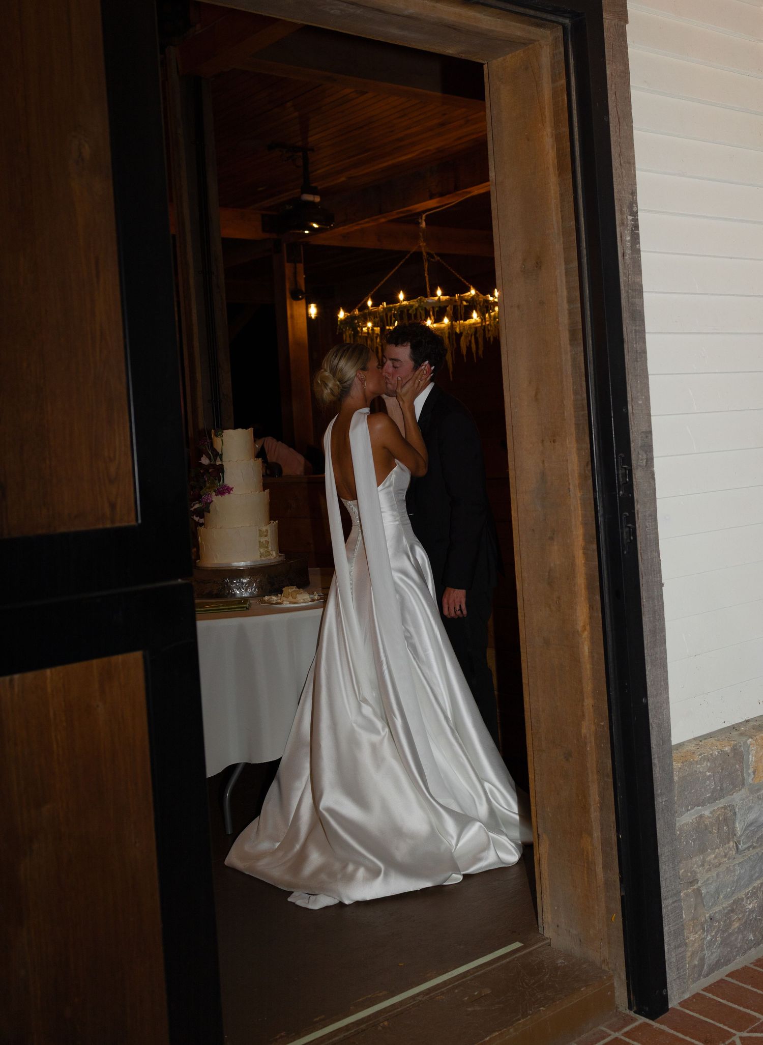 A sweet kiss tender kiss after the cake was cute. Beautiful venue in Franklin Tennessee Trinity View Farm.