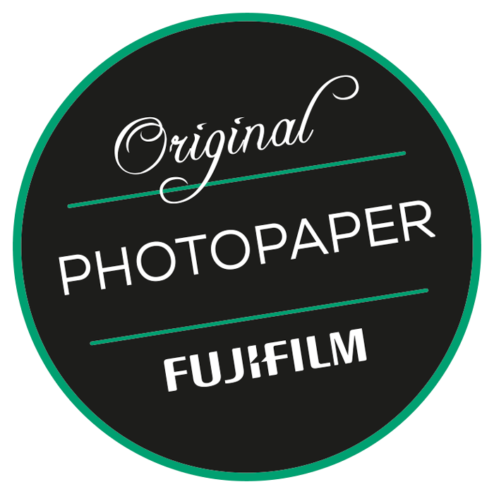 Circular black and green Fujifilm Original Photopaper logo badge.