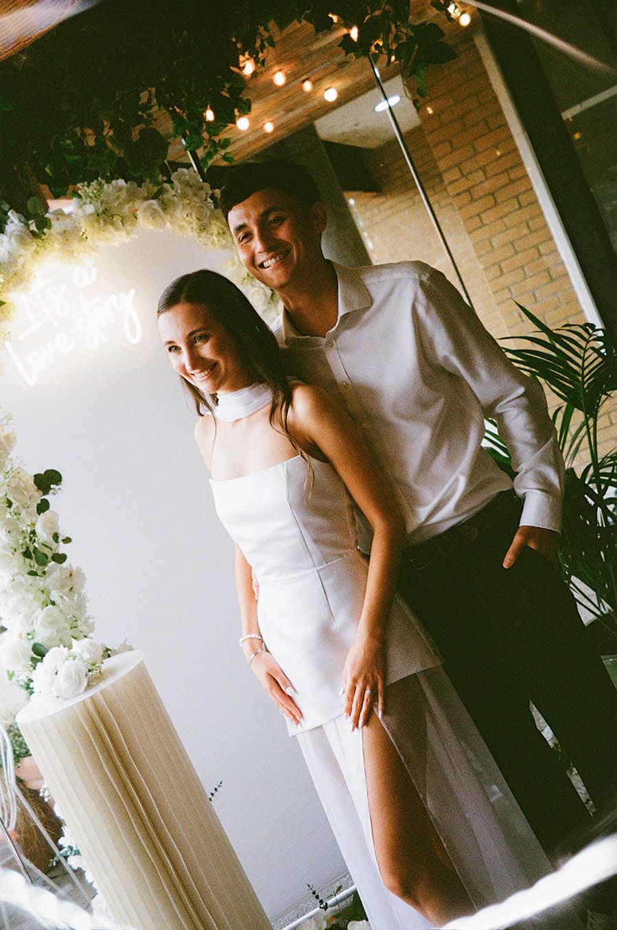 A romantic collage of a couple sharing intimate moments on their wedding day in a warmly lit room with string lights.