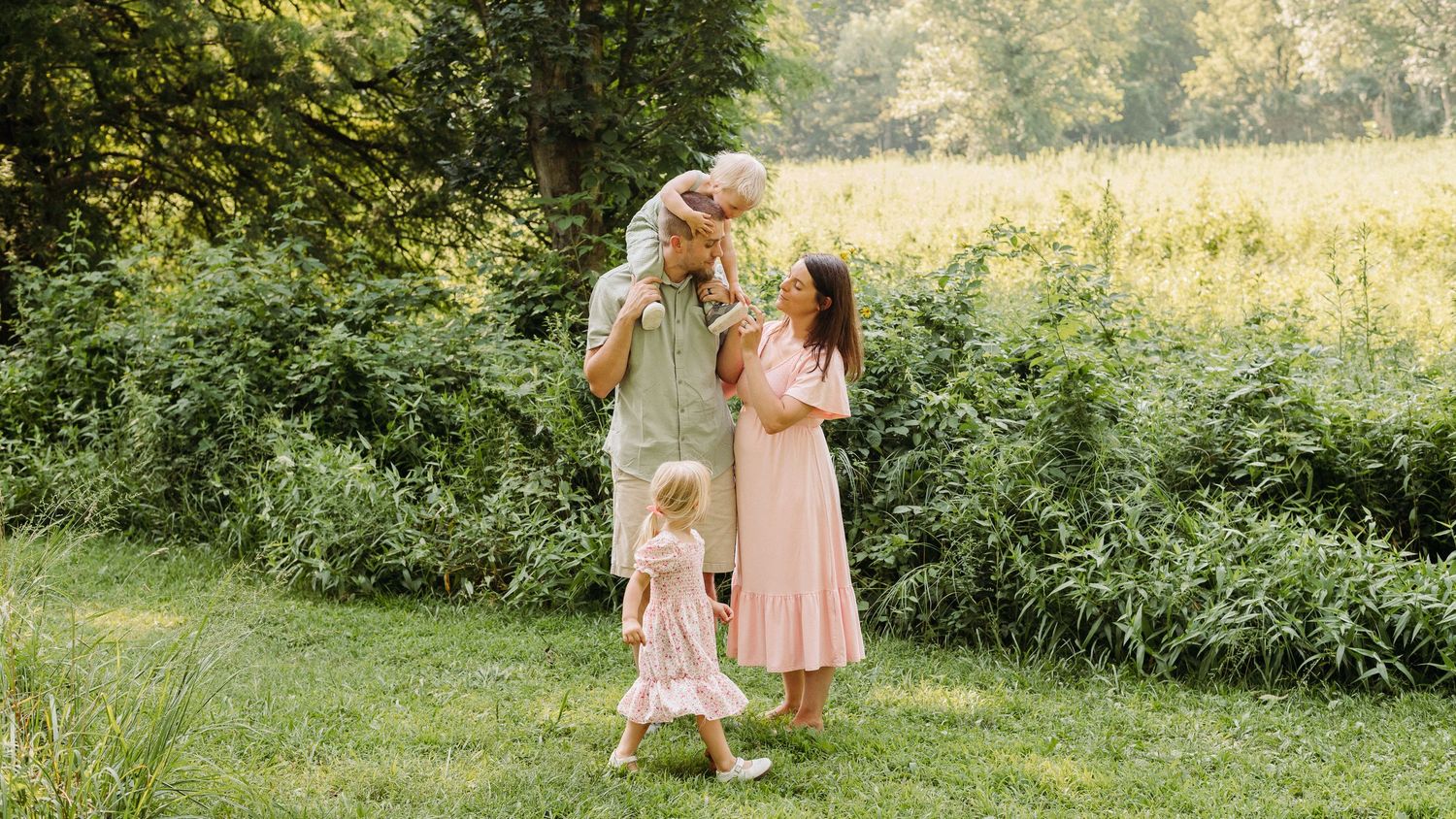 A series of outdoor photos showing people in light colored dresses walking through a sunlit meadow at golden hour in Wyomissing PA.