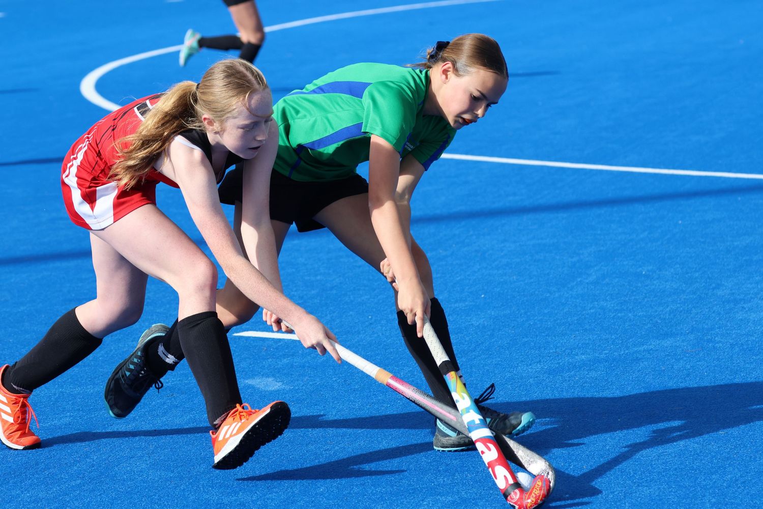 Havelock North Intermediate School player fighting for control of the ball at the Hawke's Bay Intermediate School Winter Hockey Competition